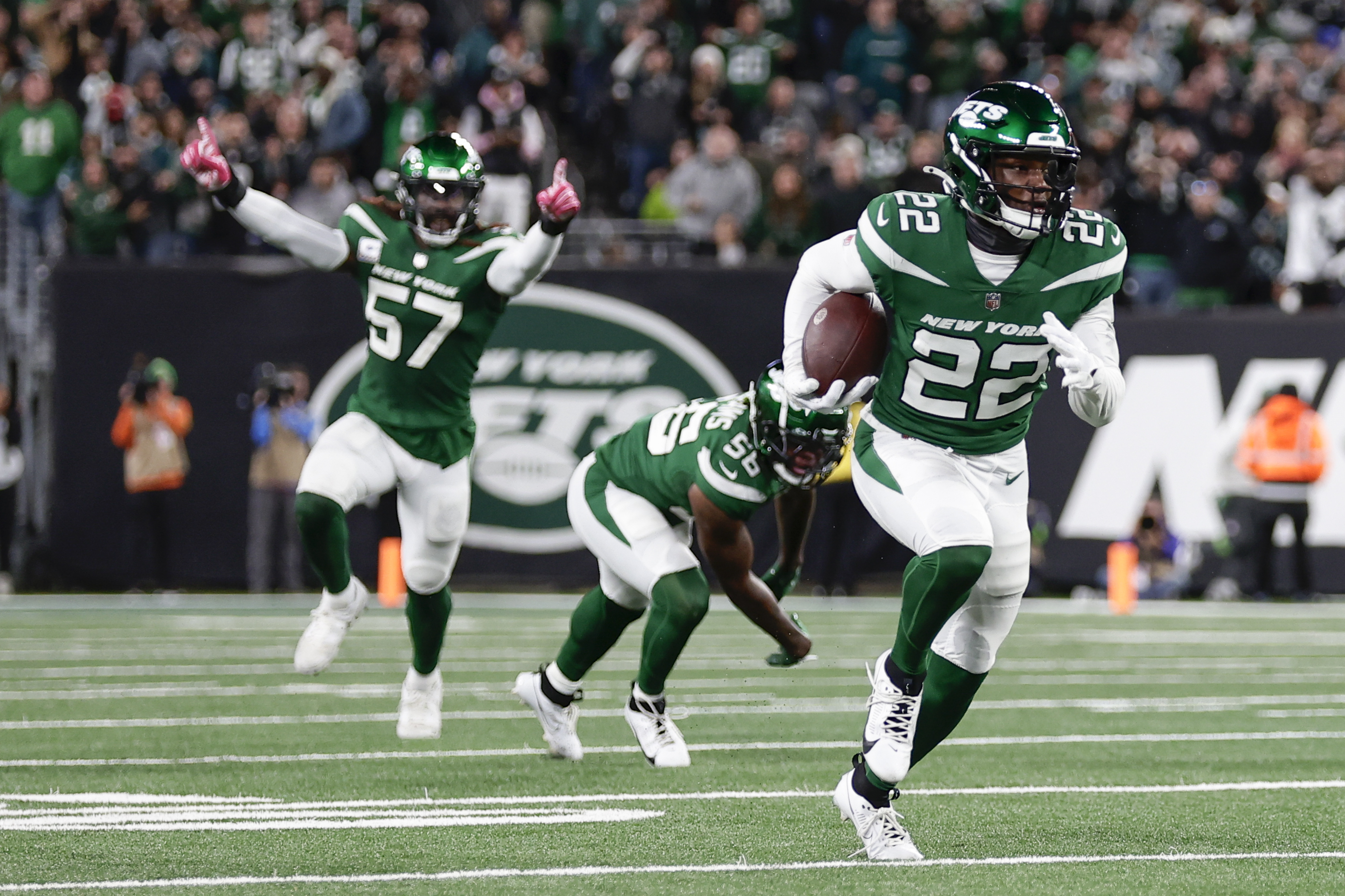 New York Jets' Tony Adams, right, runs with the ball after an interception during the second half of an NFL football game against the Philadelphia Eagles, Sunday, Oct. 15, 2023, in East Rutherford, N.J. 