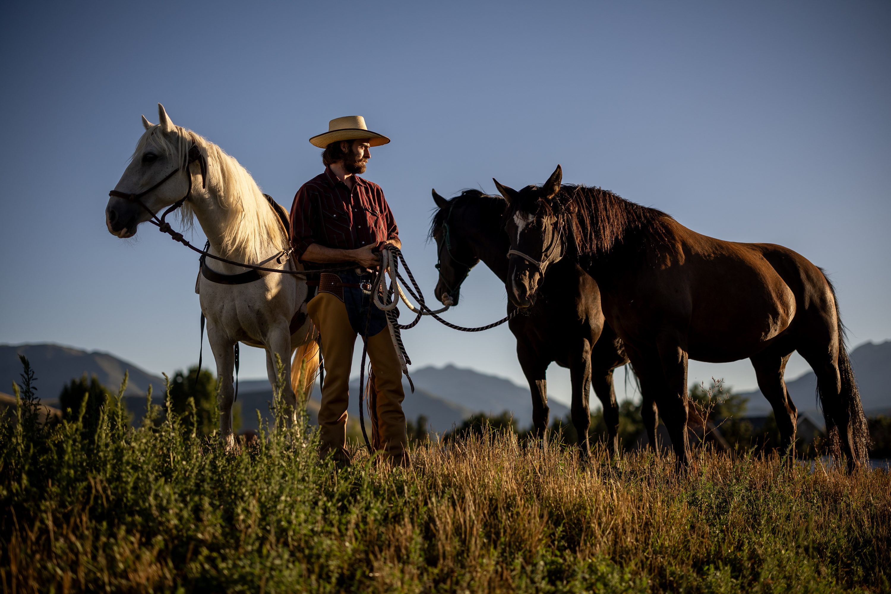 Jake Harvath poses for a photo with his three horses, Bella, Denver and Eddy, left to right, at Sage Creek Equestrian in Charleston, Wasatch County, on Sept. 5, as he prepares to embark on a yearlong cross-country horse ride.