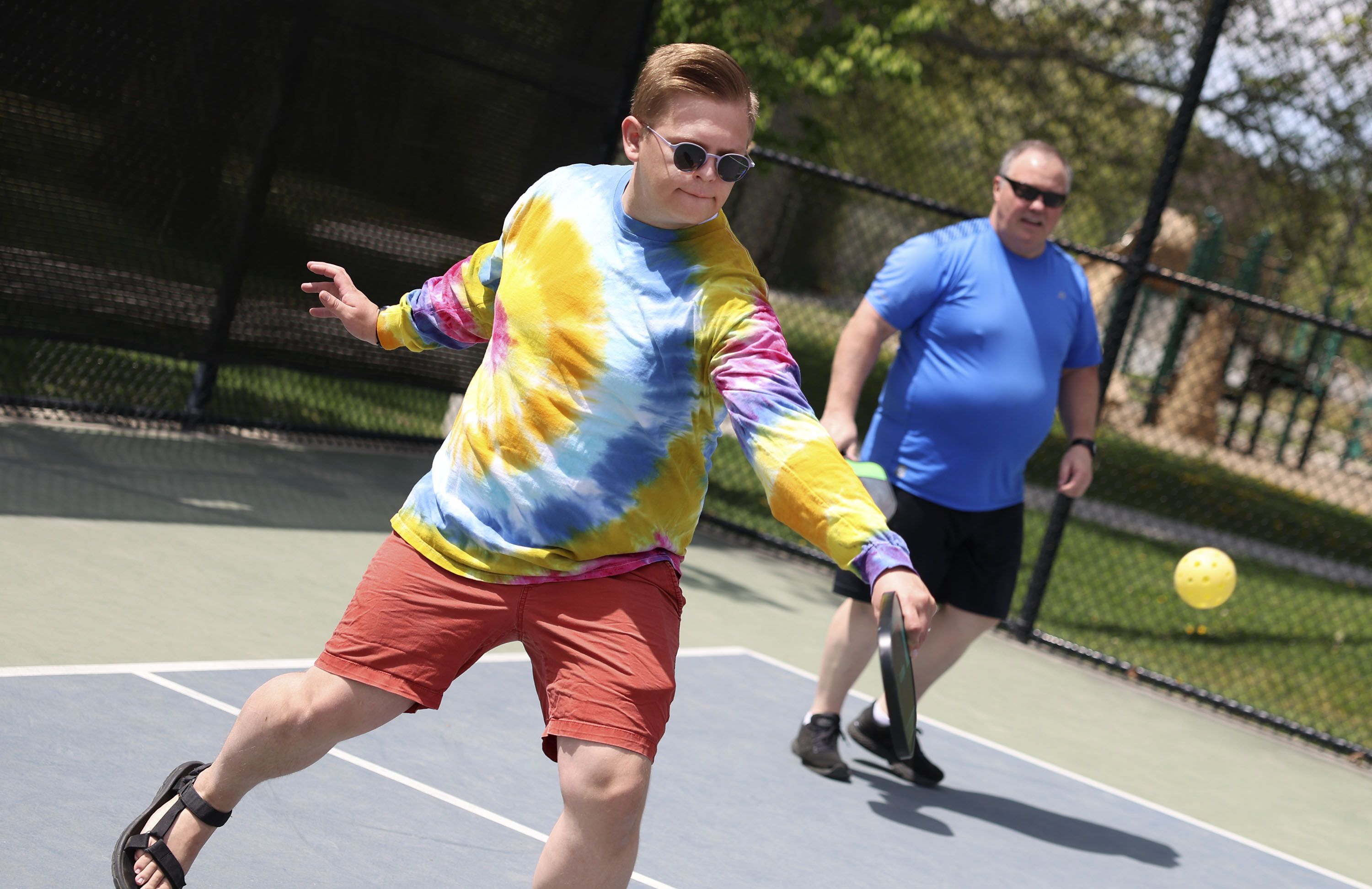 James Ostergar and Mark Mitchell play pickleball with co-workers during a staff picnic at Fairmont Park in Salt Lake City on May 12. One survey says Utah is the No. 1 state for pickleball.