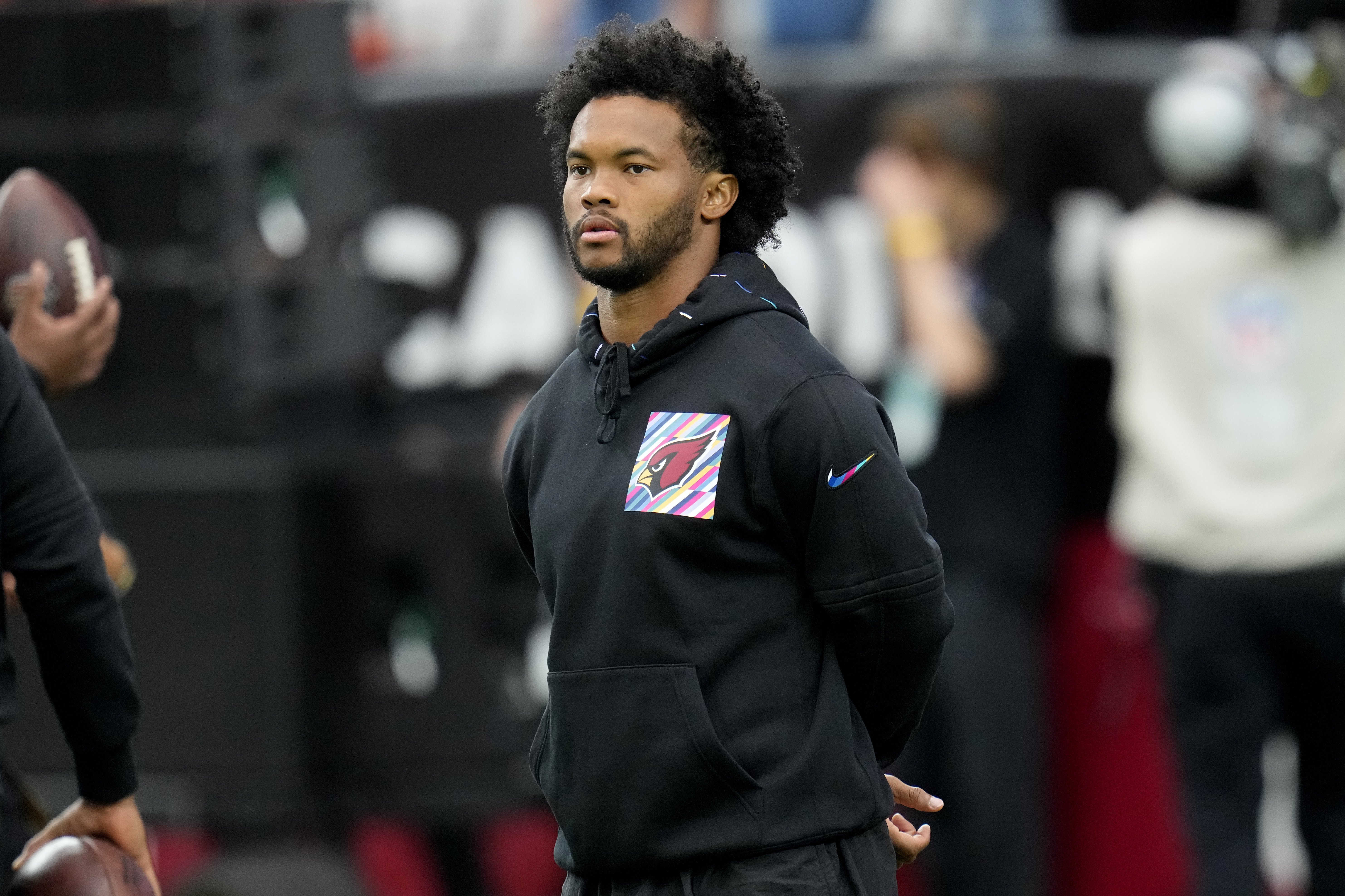 Arizona Cardinals quarterback Kyler Murray watches warm ups prior to an NFL football game against the Cincinnati Bengals, Sunday, Oct. 8, 2023, in Glendale, Ariz. 