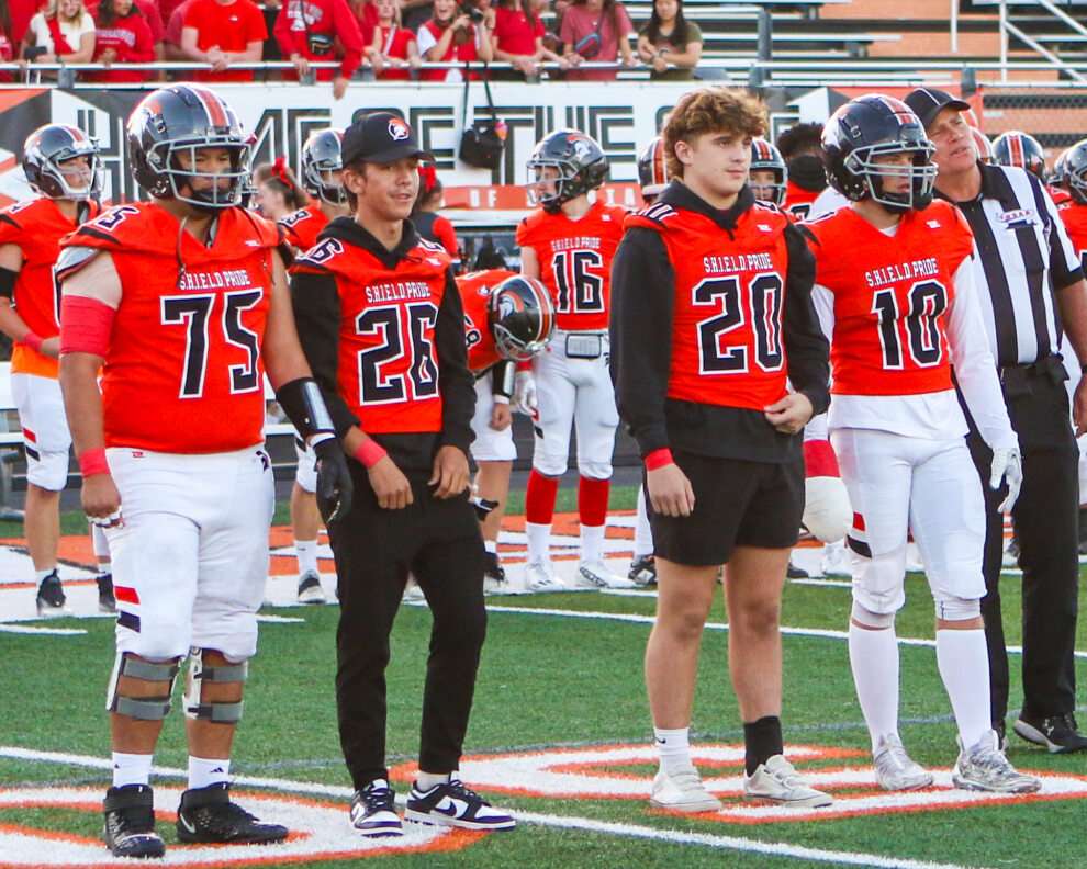 Murray High School football team wears red wristbands and armbands to support Kate Macfarlane as they play.