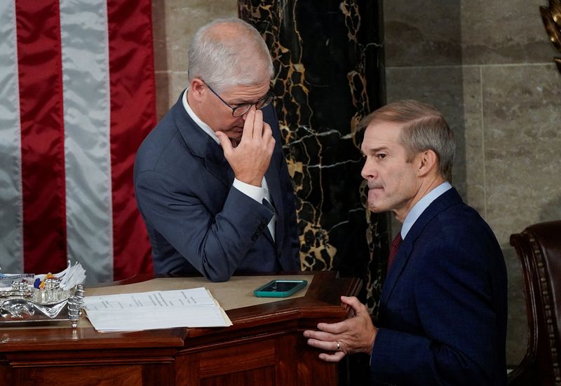 Speaker of the House Pro Tempore Patrick McHenry, R-N.C., talks with U.S. Rep. Jim Jordan, R-Ohio, currently the top contender in the race to be the next Speaker of the U.S. House of Representatives.