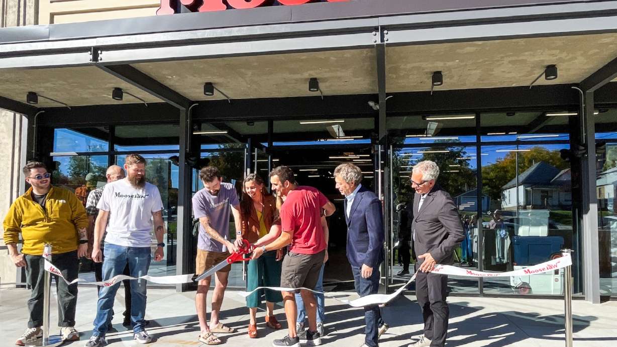 Moosejaw employees and Salt Lake leaders cut a ribbon to open a Moosejaw store at 470 S. 900 East in Salt Lake City Thursday. It's the outdoor retail chain's first location in Utah.