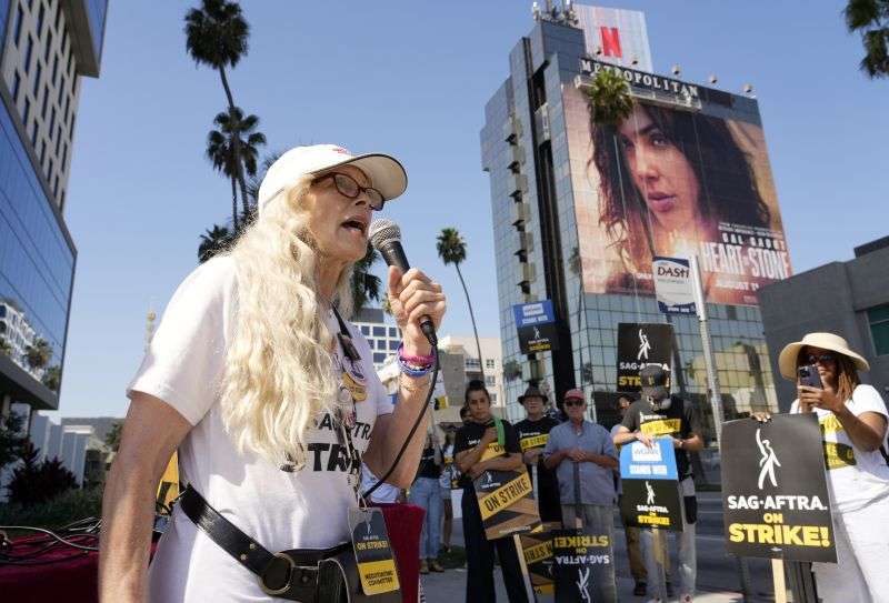 Actor Frances Fisher addresses picketers outside Netflix studios, Tuesday in Los Angeles.