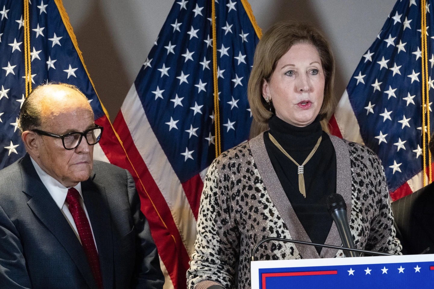 Sidney Powell, right, speaks next to former Mayor of New York Rudy Giuliani at the Republican National Committee headquarters on Nov. 19, 2020, in Washington. Powell has pleaded guilty to reduced charges over efforts to overturn Donald Trump’s loss in the 2020 election in Georgia. Powell is the second defendant in the sprawling case to reach a deal with prosecutors.