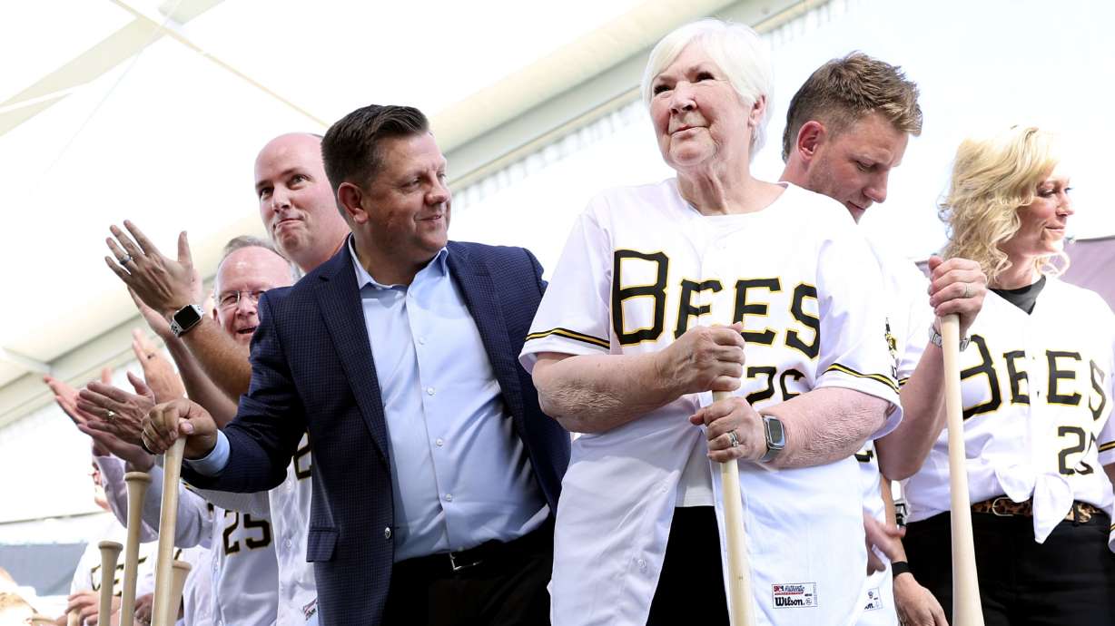 Gail Miller, center, smiles after throwing dirt at the celebration and groundbreaking event of the new Salt Lake Bees ballpark and Phase 1 of Downtown Daybreak in South Jordan on Thursday.