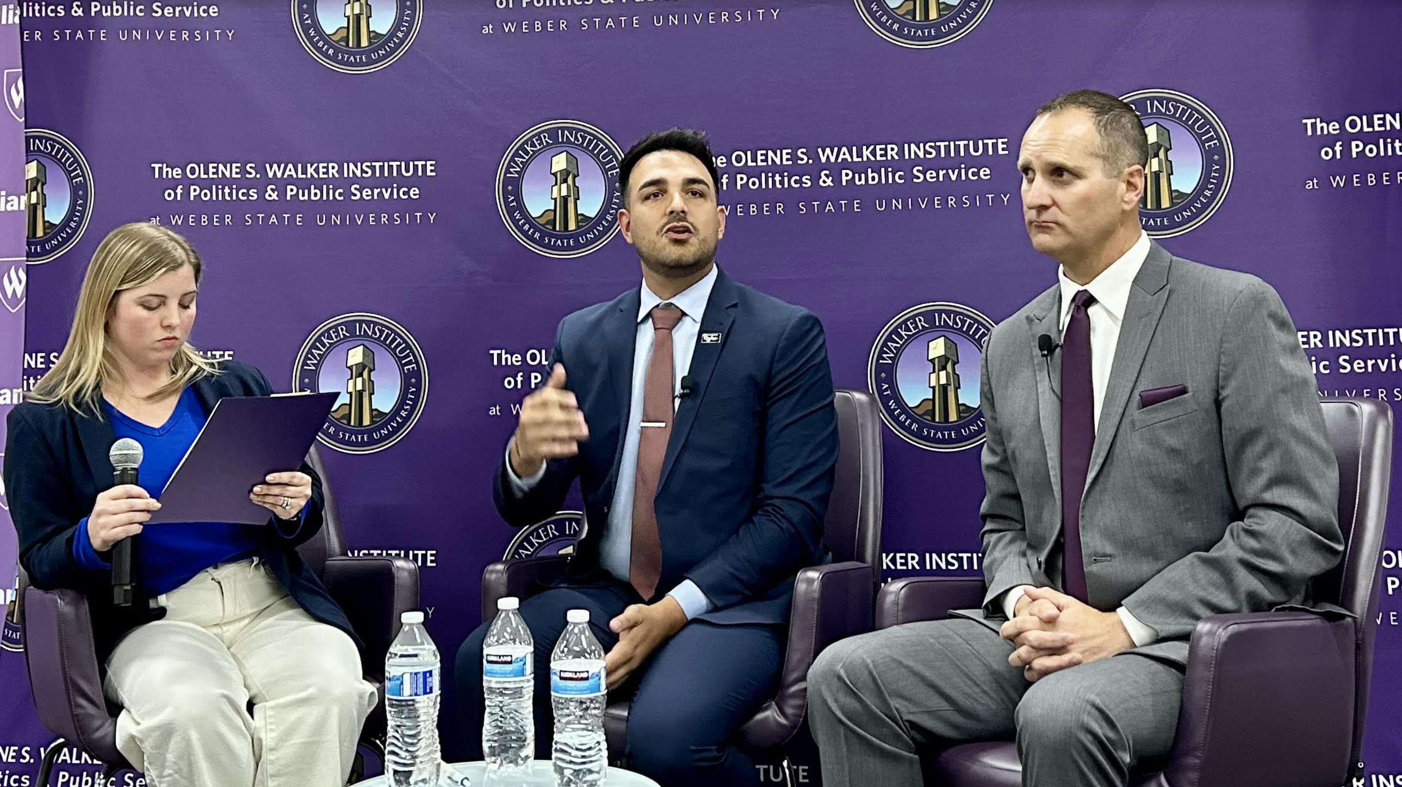 Ogden mayoral candidate Taylor Knuth, center, speaks during a debate at Weber State University Thursday night as candidate Ben Nadolski, right, and moderator Caroline Ballard look on.
