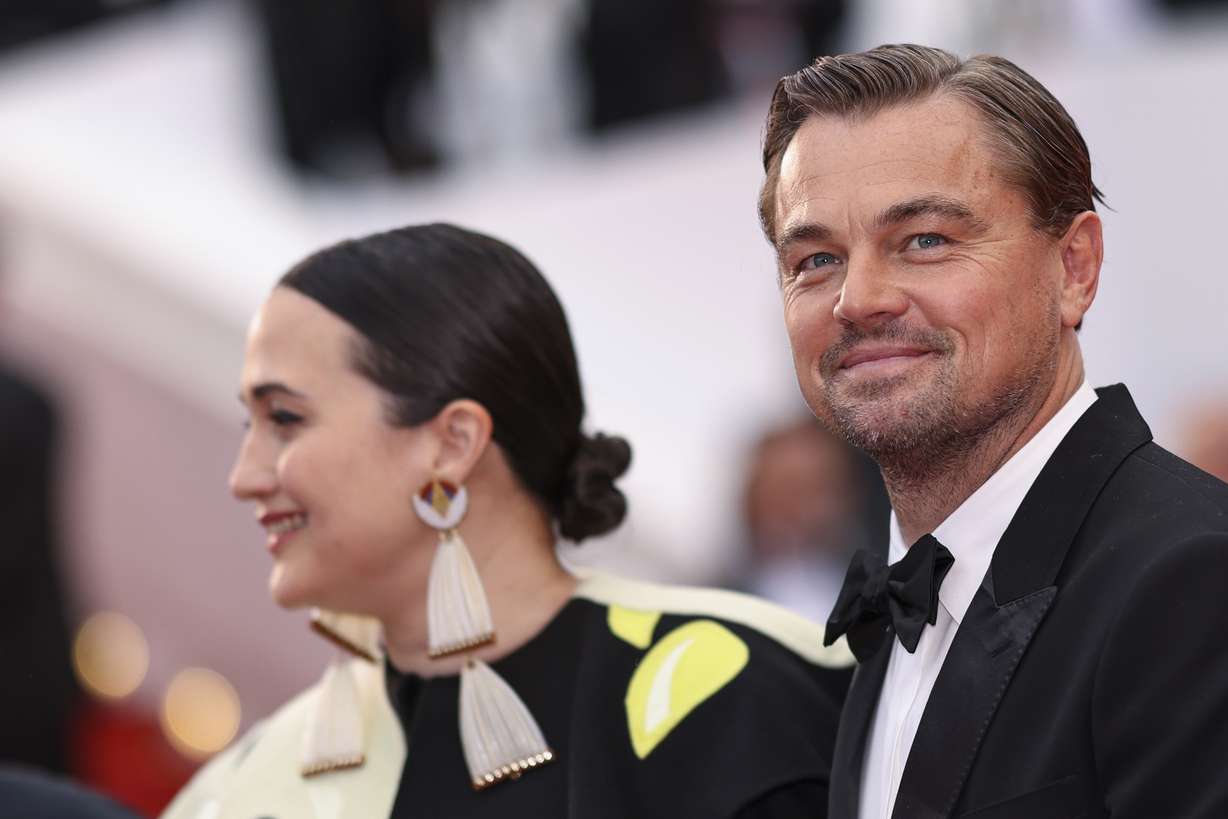 Lily Gladstone, left, and Leonardo DiCaprio pose for photographers upon arrival at the premiere of the film 'Killers of the Flower Moon' at the 76th international film festival, Cannes, southern France, May 20.