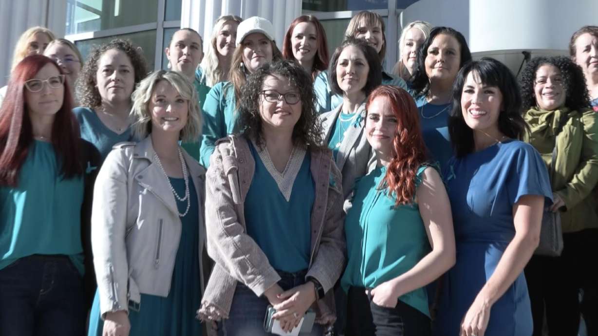 Women who claim they were abused by a Provo OB-GYN pose for a photo on the steps of the Matheson Courthouse after their case was argued before the Utah Supreme Court on Oct. 20, 2023. On Thursday, the court ruled in their favor, reviving their lawsuit.