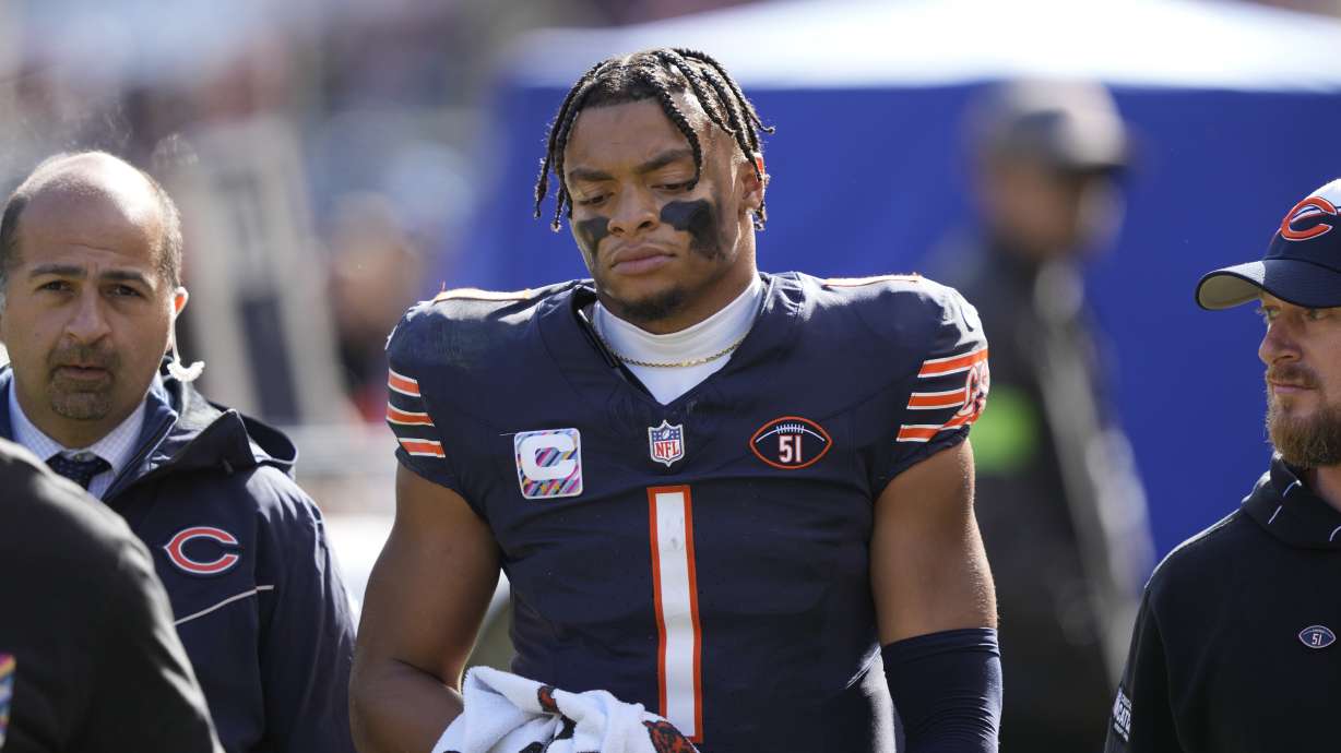 Chicago Bears quarterback Justin Fields walks to the locker room after being sacked during the second half of an NFL football game against the Minnesota Vikings, Sunday, Oct. 15, 2023, in Chicago.