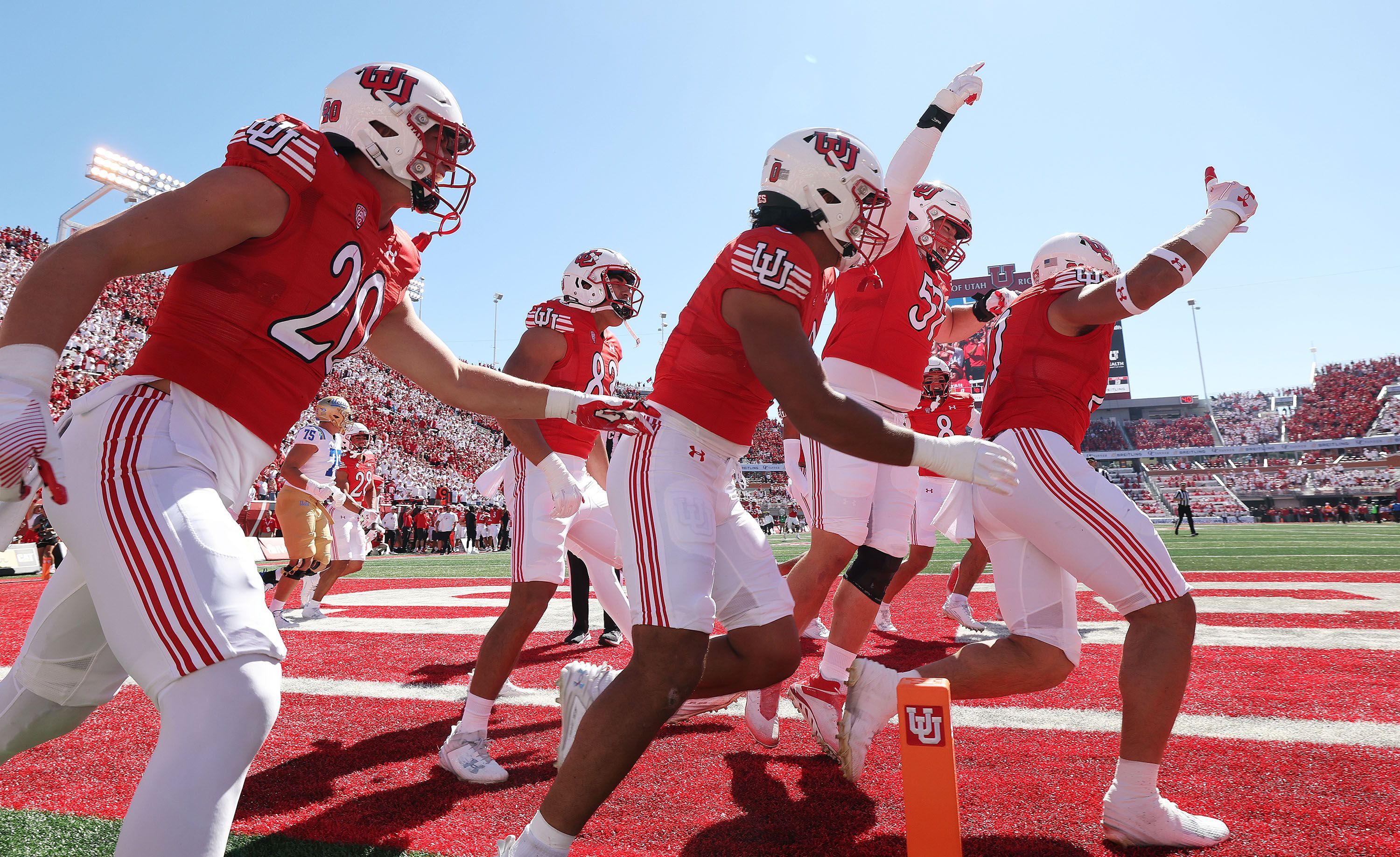 Utah Utes linebacker Karene Reid (21) celebrates his pick-six against the UCLA Bruins in Salt Lake City on Sept. 23.