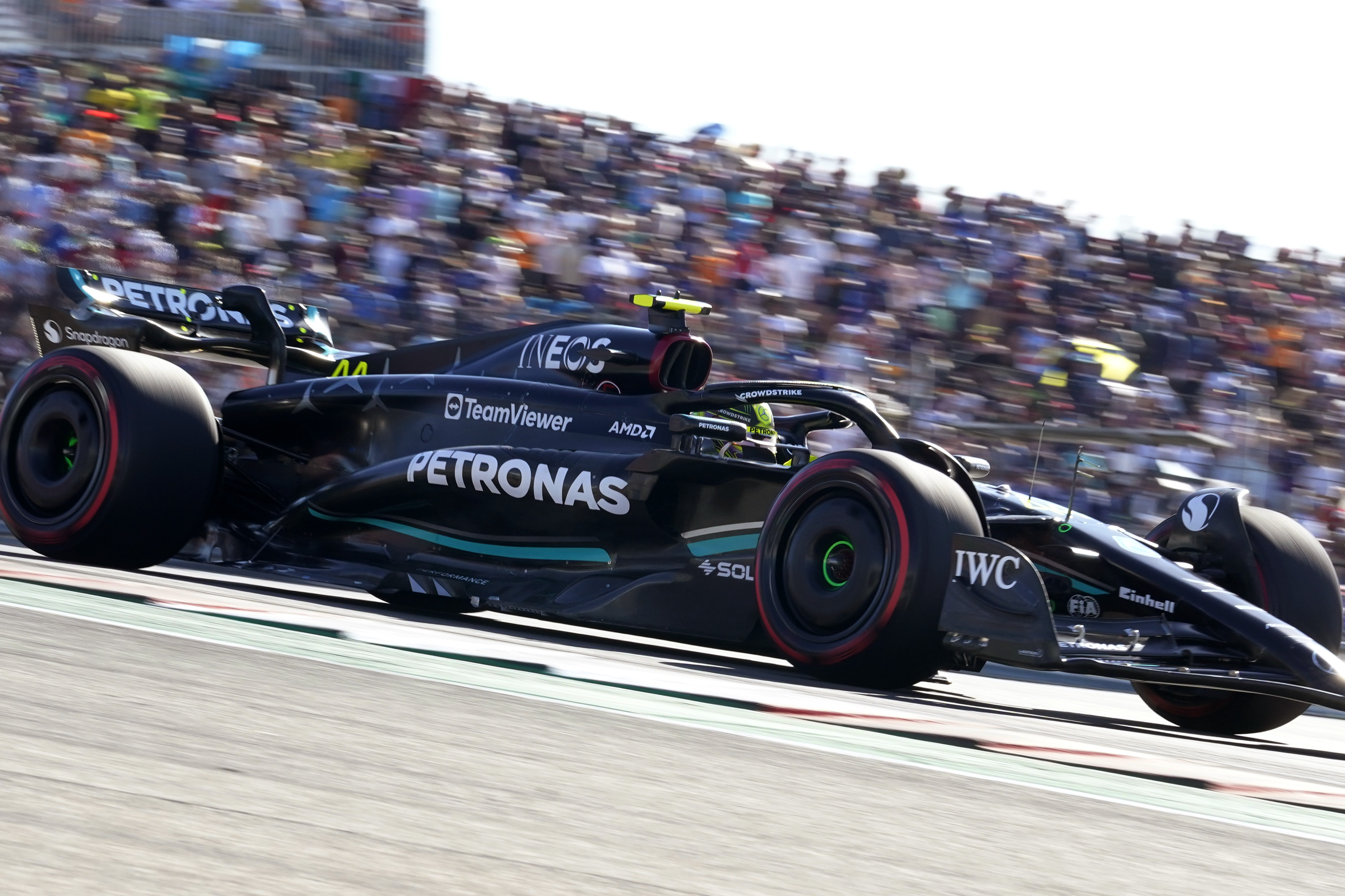 Mercedes driver Lewis Hamilton, of Britain, steers through a turn during a qualifying session for the Formula One U.S. Grand Prix auto race at Circuit of the Americas, Friday, Oct. 20, 2023, in Austin, Texas. 