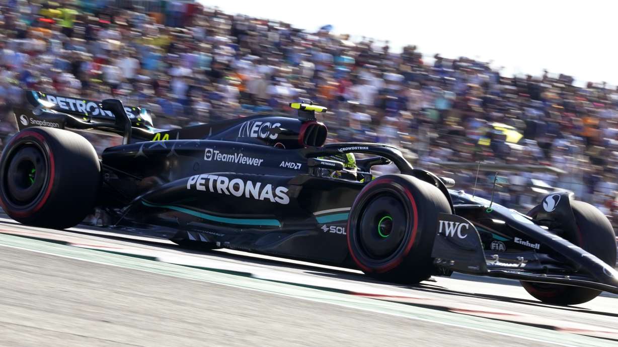 Mercedes driver Lewis Hamilton, of Britain, steers through a turn during a qualifying session for the Formula One U.S. Grand Prix auto race at Circuit of the Americas, Friday, Oct. 20, 2023, in Austin, Texas.