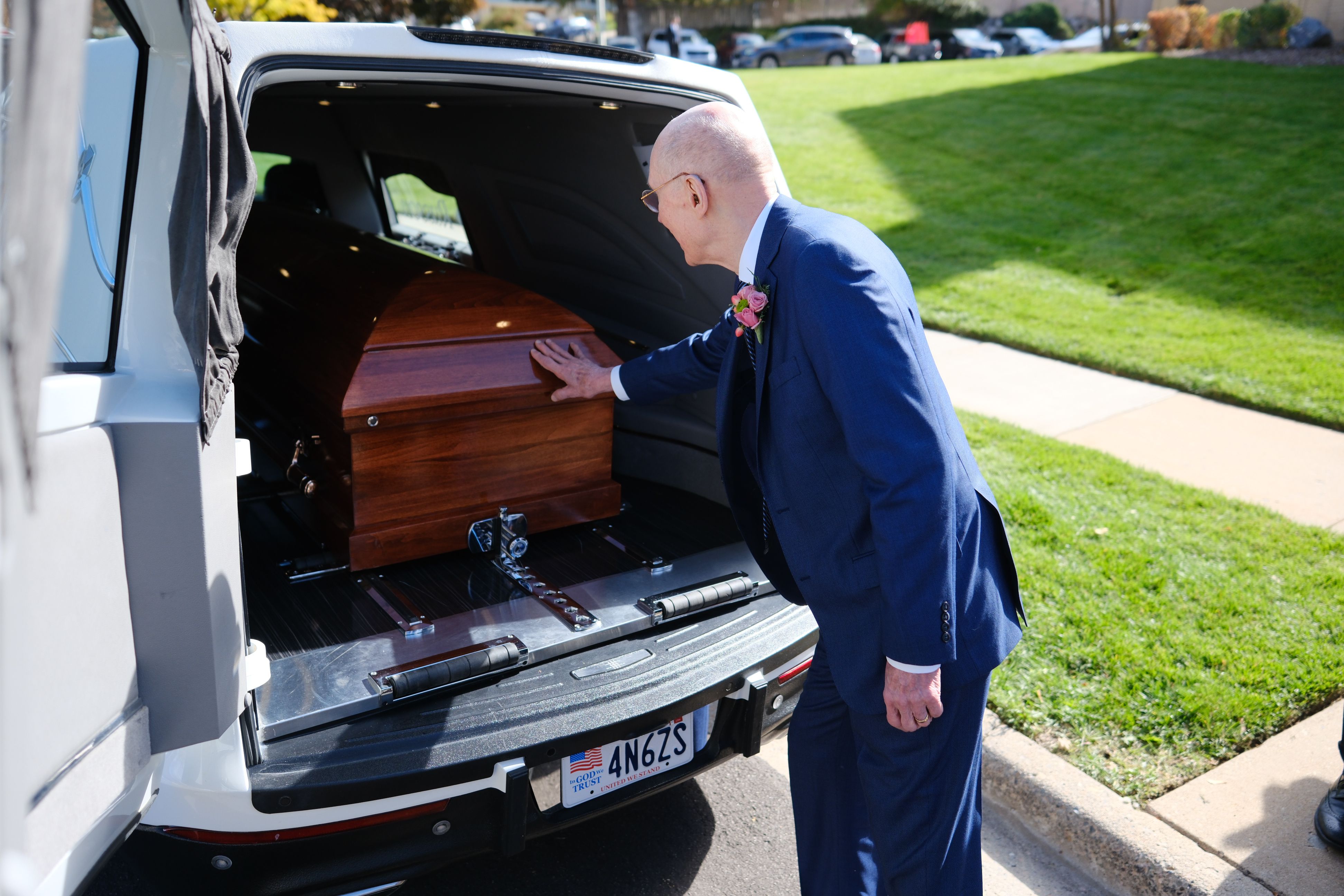 President Henry B. Eyring, second counselor in the First Presidency of The Church of Jesus Christ of Latter-day Saints, touches the casket of his wife, Sister Kathleen Johnson Eyring after her funeral in Bountiful, on Saturday.