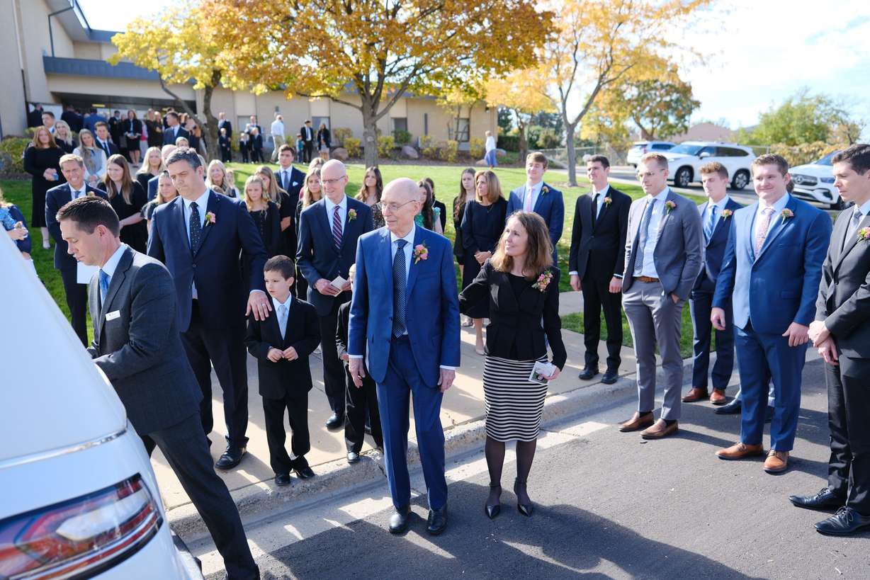 President Henry B. Eyring, second counselor in the First Presidency of The Church of Jesus Christ of Latter-day Saints, watches as the casket of his wife, Sister Kathleen Johnson Eyring, is loaded into a hearse following her funeral in Bountiful, on Saturday.