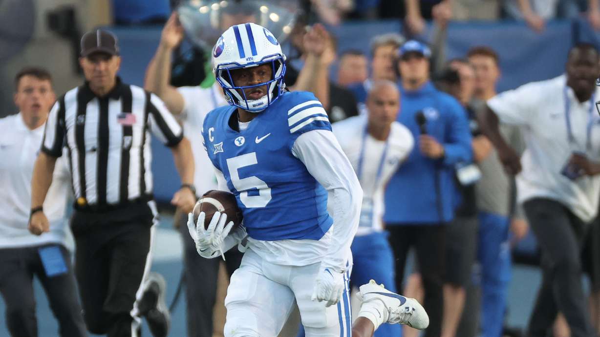 Brigham Young cornerback Eddie Heckard (5) runs the ball after his interception against the Texas Tech Red Raiders in Provo on Saturday, Oct. 21, 2023. BYU won 27-14.