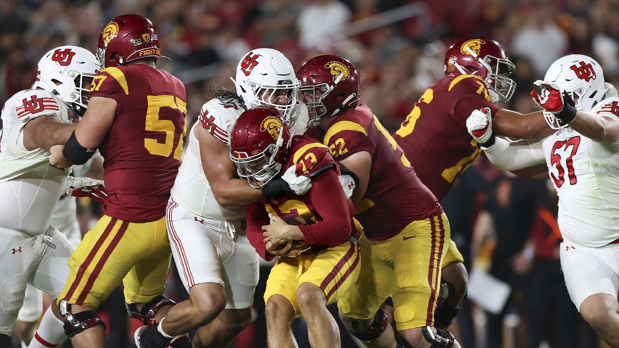 Utah Utes defensive end Van Fillinger (7) sacks USC Trojans quarterback Caleb Williams at the Los Angeles Memorial Coliseum on Saturday, Oct. 21, 2023.