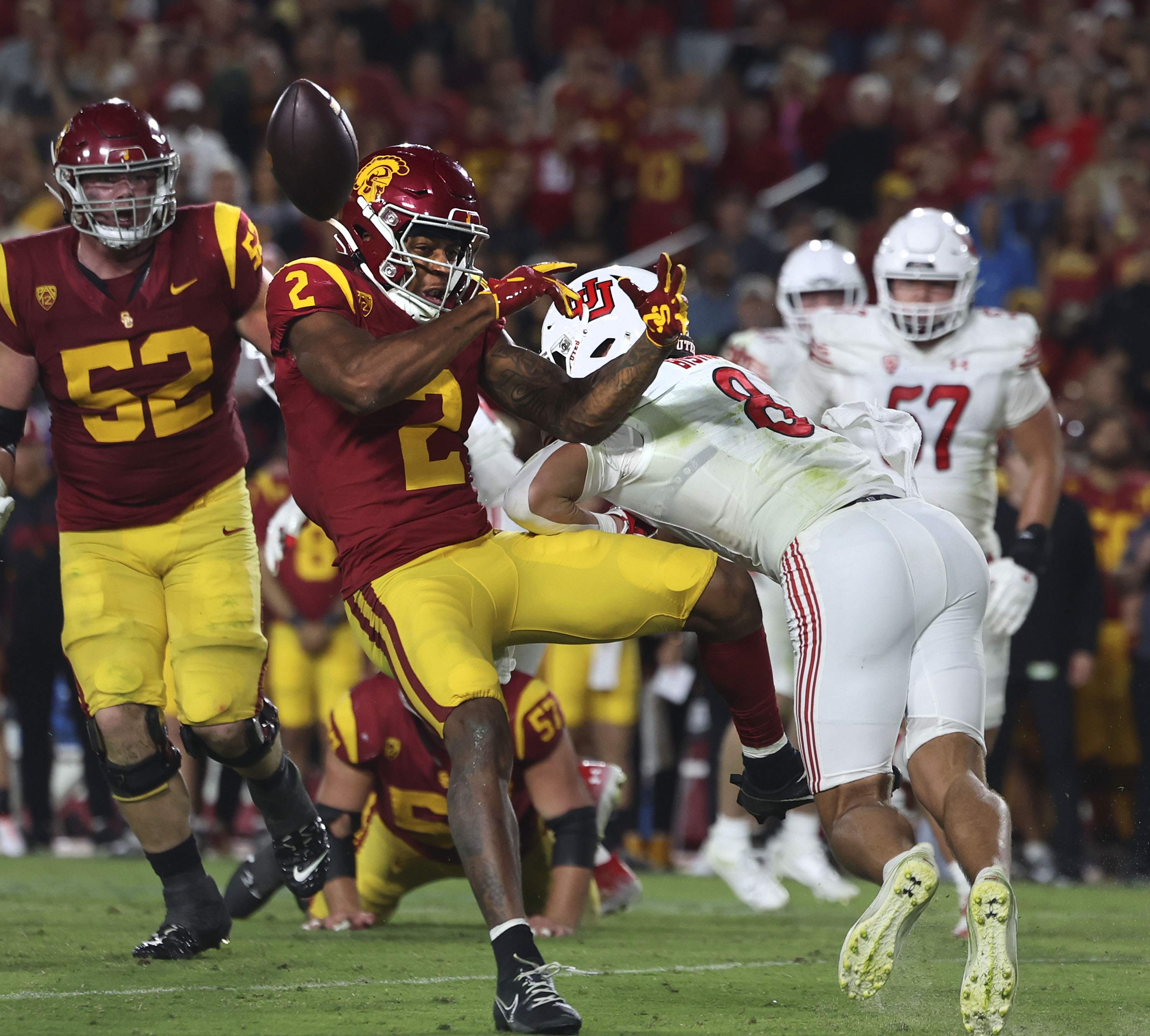 Utah Utes safety Cole Bishop (8) hits USC Trojans wide receiver Brenden Rice (2) at the Los Angeles Memorial Coliseum on Saturday, Oct. 21, 2023.