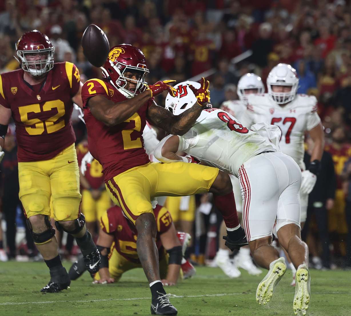 Utah Utes safety Cole Bishop (8) hits USC Trojans wide receiver Brenden Rice (2) at the Los Angeles Memorial Coliseum on Saturday, Oct. 21, 2023.