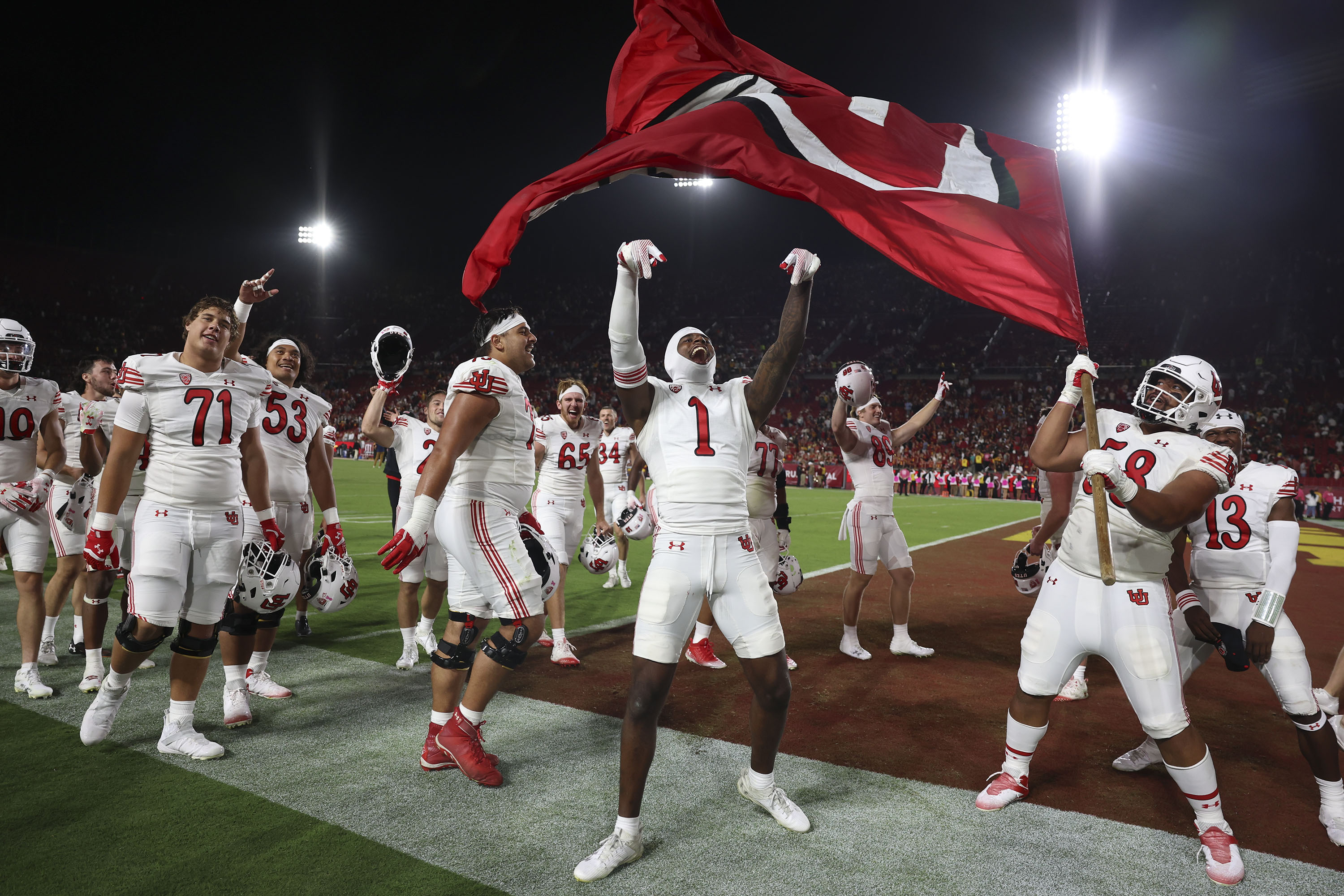 Utah celebrates their 34-32 win against the USC Trojans at the Los Angeles Memorial Coliseum on Saturday, Oct. 21, 2023.