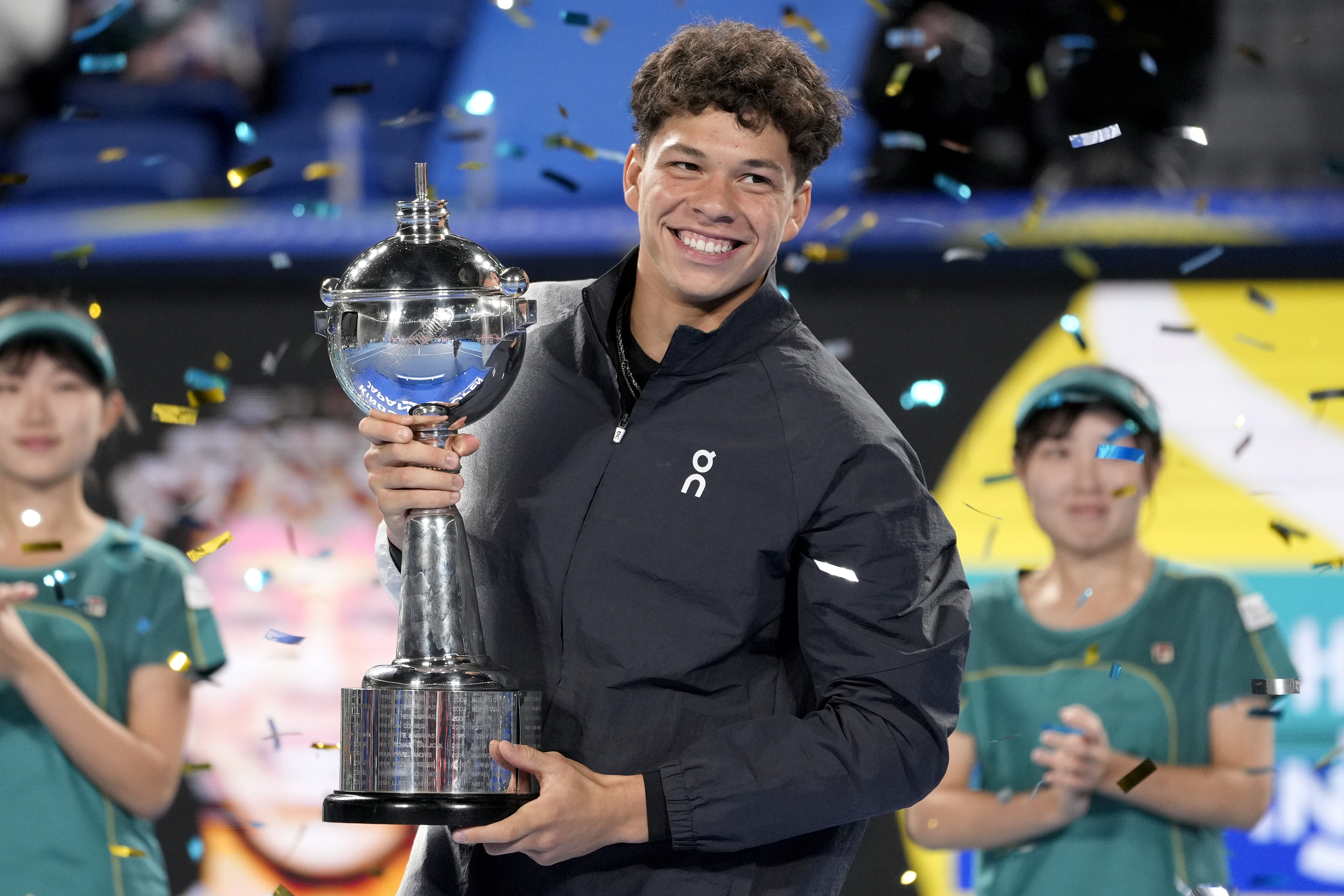 Ben Shelton of the U.S. holds the winning trophy after defeating Aslan Karatsev of Russia in the men's singles final of Japan Open tennis championships in Tokyo, Japan, Sunday, Oct. 22, 2023.