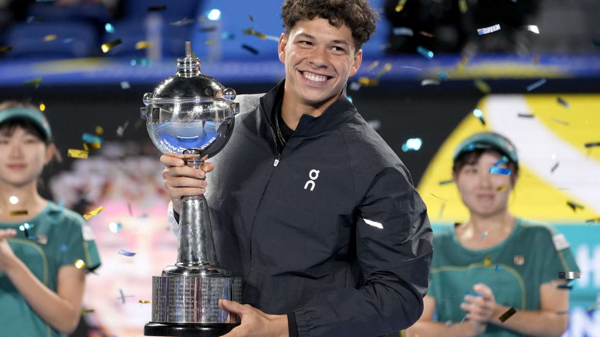 Ben Shelton of the U.S. holds the winning trophy after defeating Aslan Karatsev of Russia in the men's singles final of Japan Open tennis championships in Tokyo, Japan, Sunday, Oct. 22, 2023.