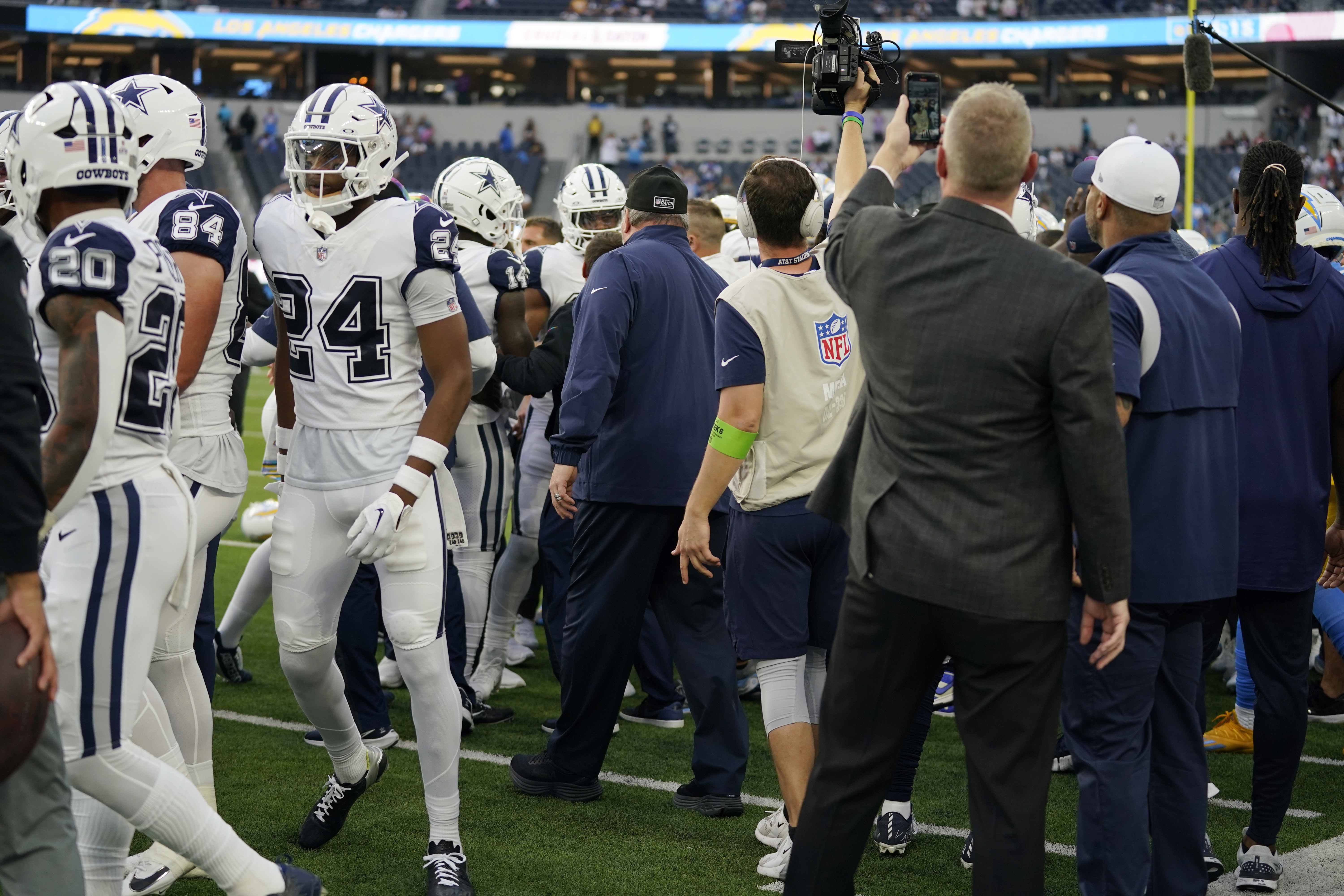 Dallas Cowboys and Los Angeles Chargers players get into a shoving match before an NFL football game Monday, Oct. 16, 2023, in Inglewood, Calif. 