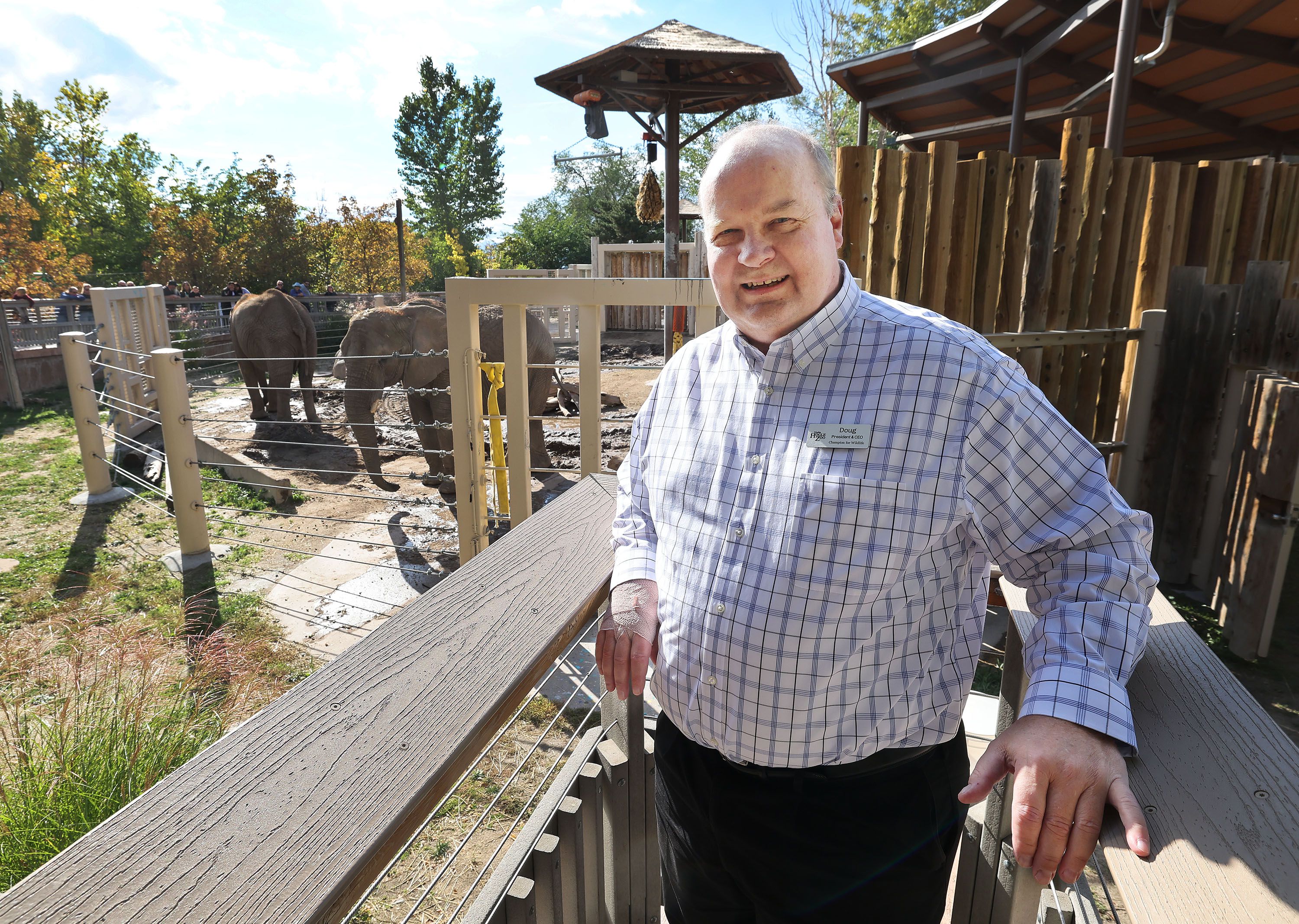 Hogle Zoo president Doug Lund stands near elephant mother Christie and daughter Zuri at the zoo in Salt Lake City on Oct. 13. The elephants have been relocated.