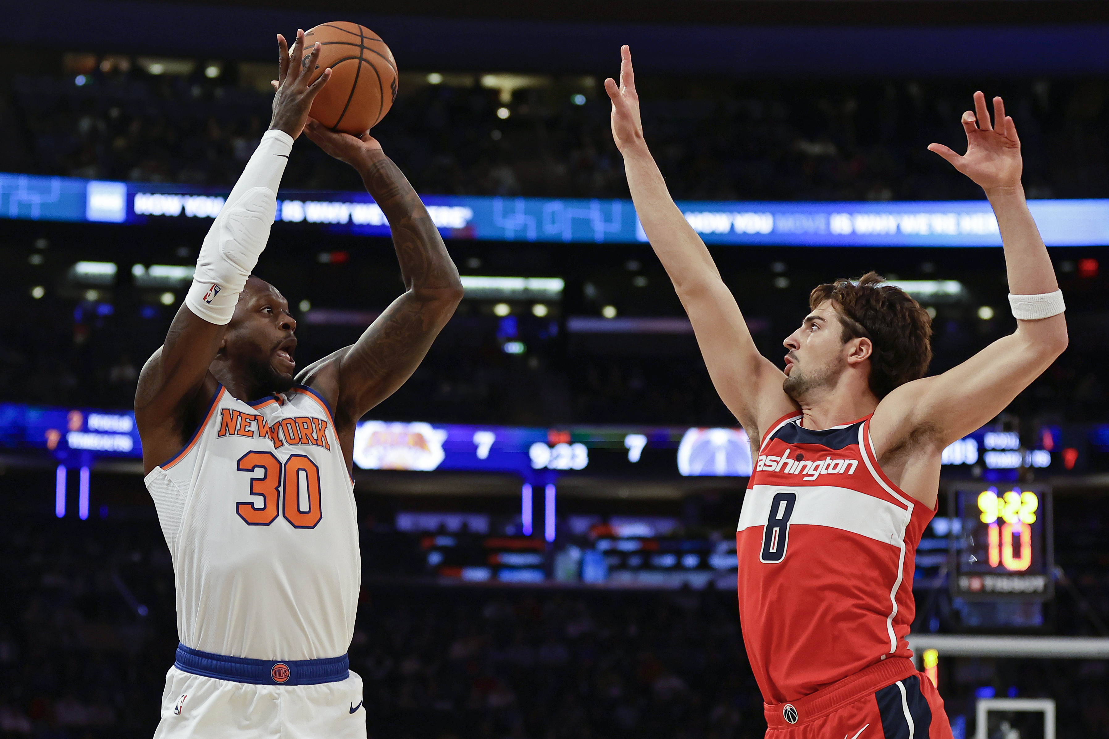 New York Knicks forward Julius Randle (30) shoots over Washington Wizards forward Deni Avdija (8) during the first half of a preseason NBA basketball game Wednesday, Oct. 18, 2023, in New York. 