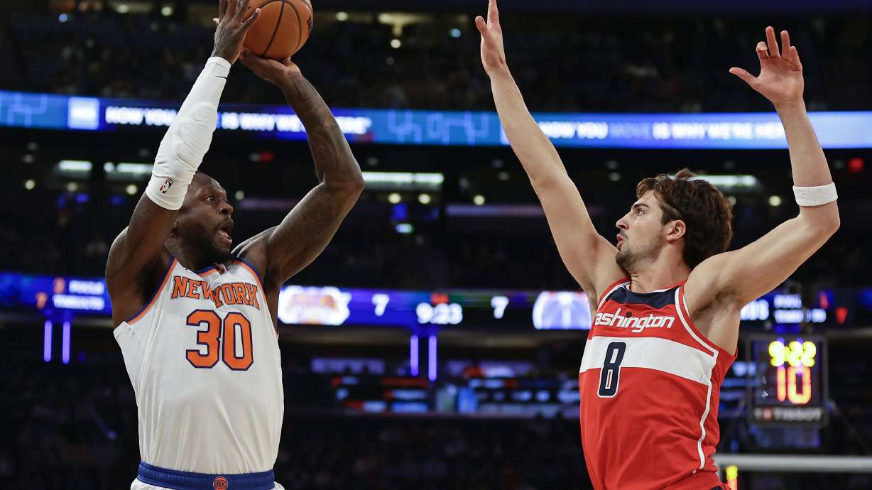 New York Knicks forward Julius Randle (30) shoots over Washington Wizards forward Deni Avdija (8) during the first half of a preseason NBA basketball game Wednesday, Oct. 18, 2023, in New York.