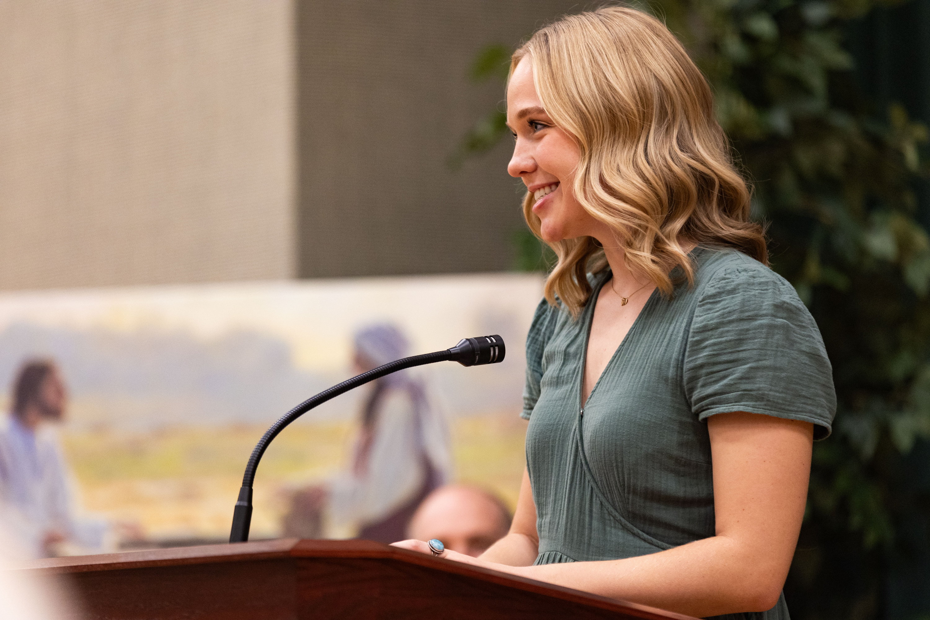 Grace Miller, a Utah Valley University student, speaks at a media briefing at a chapel across from the Orem Utah Temple on Monday.