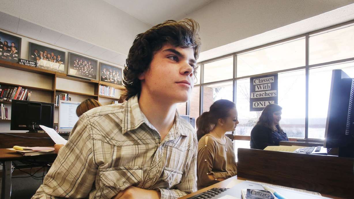 Zach Fritzsche fills out college application forms on Nov. 11, 2013. Utah Tech University and Dixie Technical College partnered with the goal of helping every high school senior in the county complete a college or university application.
