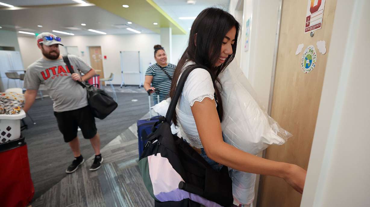 Amber San Miguel unlocks her dorm room as she moves into the University of Utah student housing in Salt Lake City on Aug. 16. Incoming first-year students who apply for housing at the U. by May 3 will be guaranteed a bed on campus.