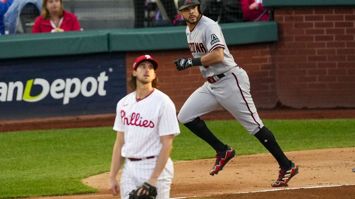 Arizona Diamondbacks' Tommy Pham watches his home run off Philadelphia Phillies starting pitcher Aaron Nola during the second inning in Game 6 of the baseball NL Championship Series in Philadelphia Monday, Oct. 23, 2023.