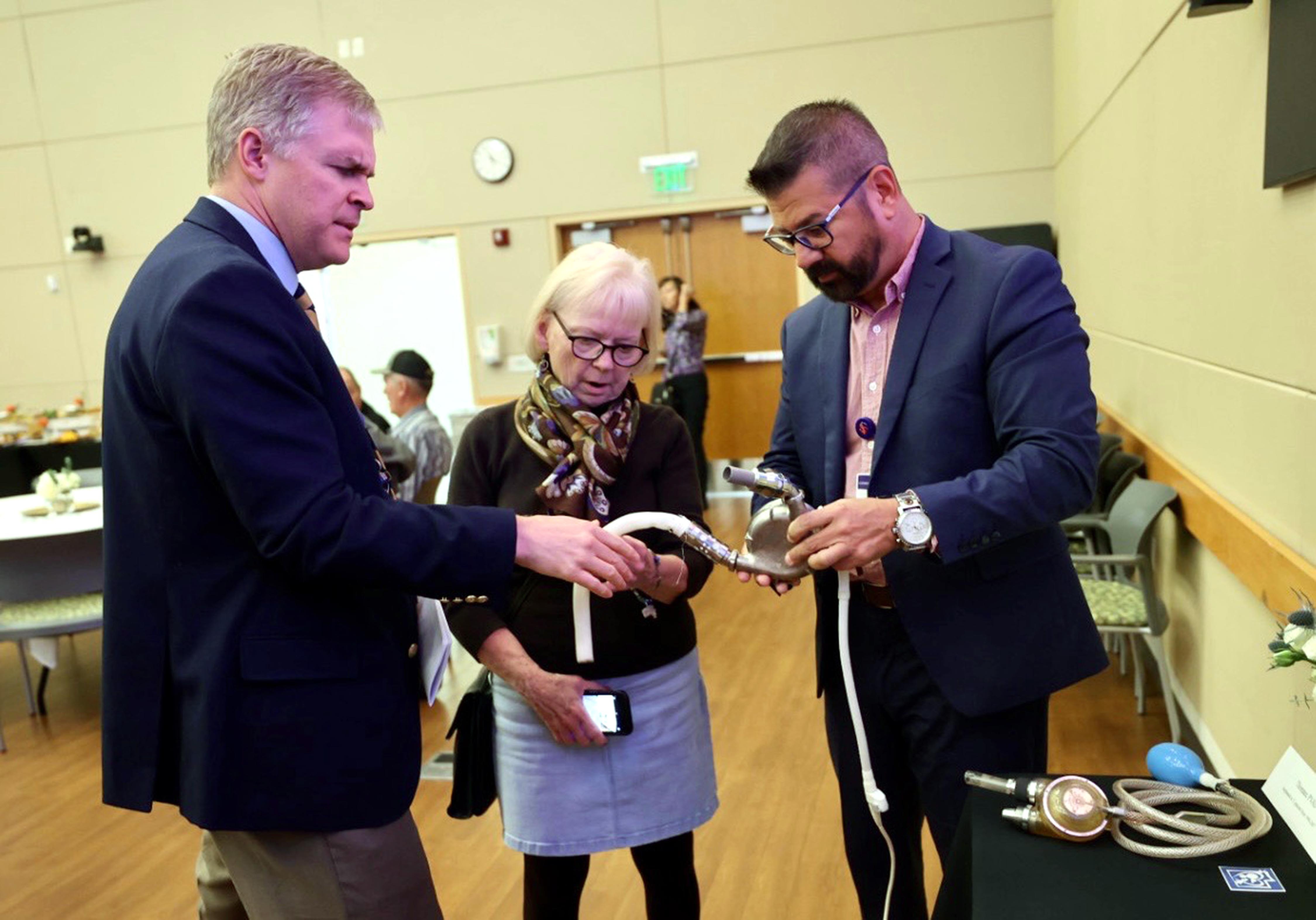 Dr. Stephen McKellar speaks to Karla Pardini and Jess Gomez. Pardini’s husband had a heart attack at age 43 and went on to live another 19.5 years. They are looking at HeartMate XVE, which was implanted in 82 patients including Victor Pardini.