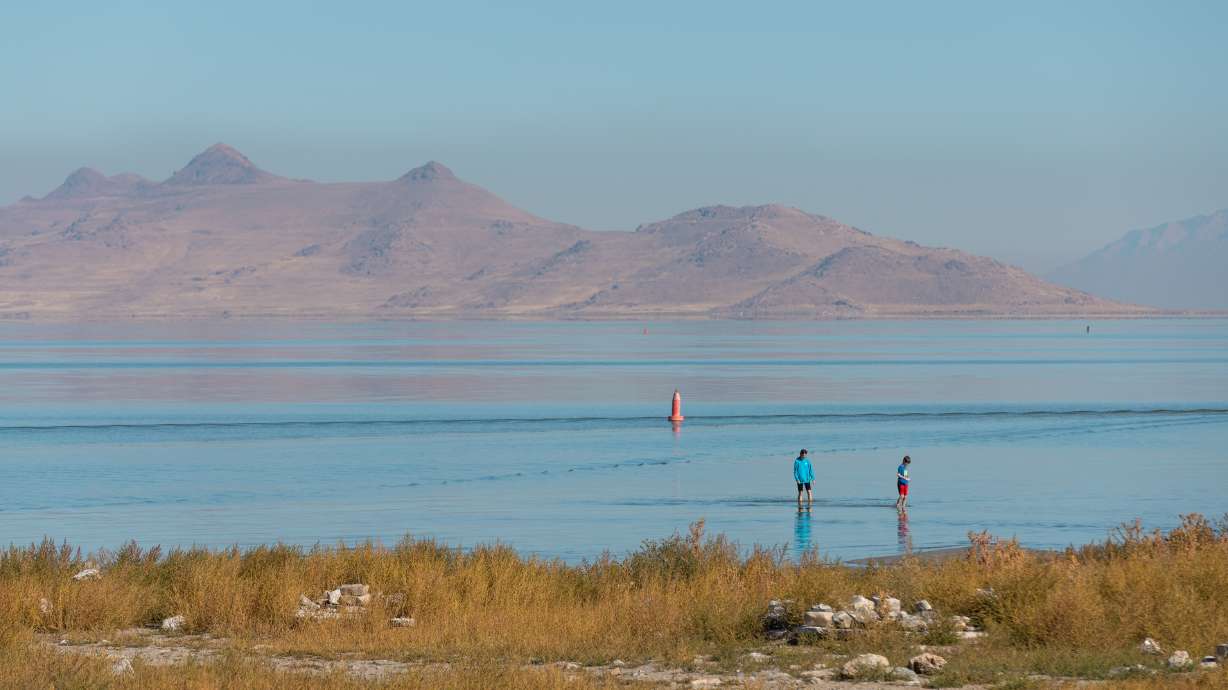 A family at Great Salt Lake State Park in Magna on Oct. 6. A pipeline sending ocean water from the California coast to the Great Salt Lake would cost hundreds of millions to operate annually, according to a new BYU study.