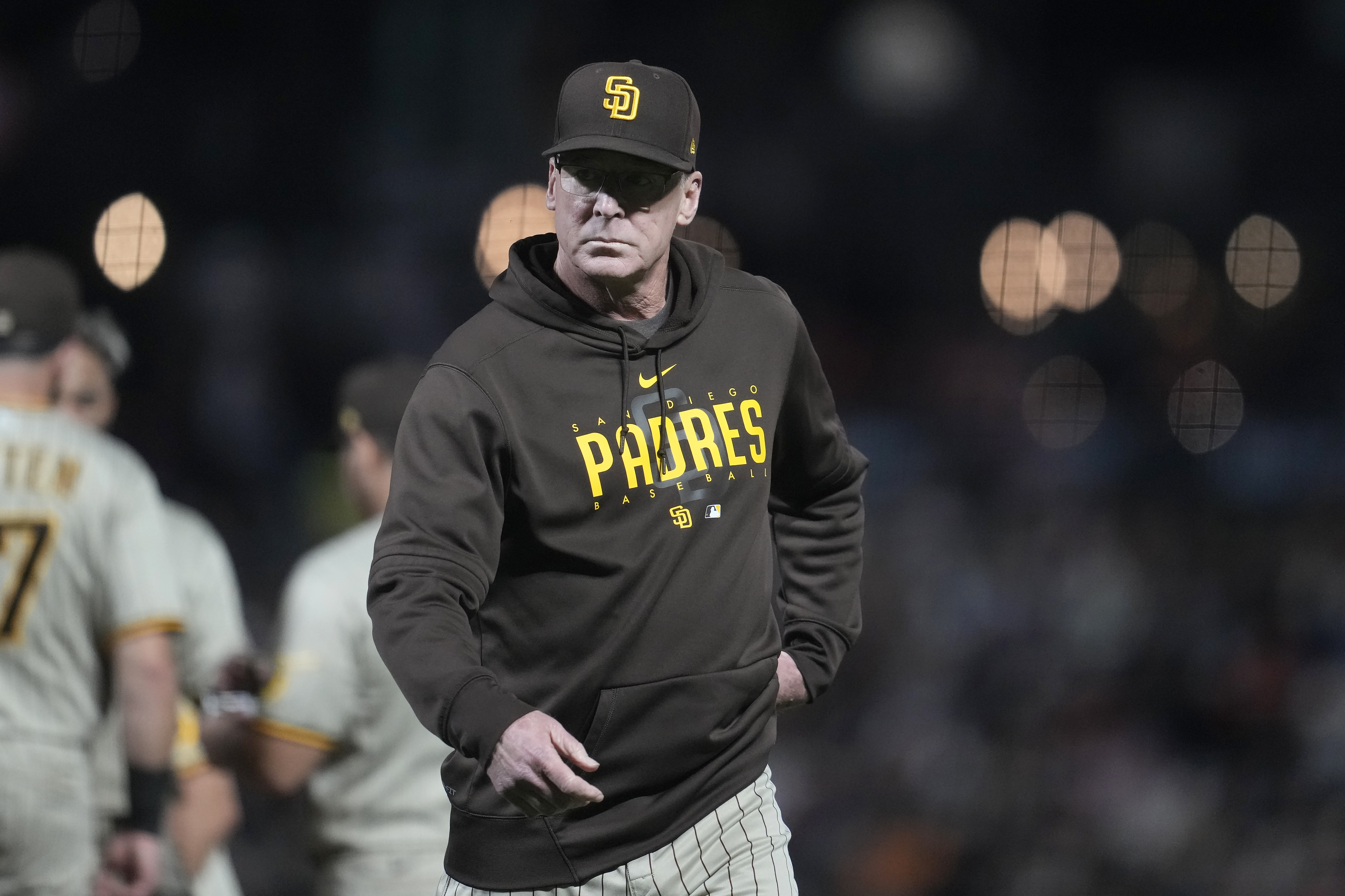 San Diego Padres manager Bob Melvin walks to the dugout after making a pitching change during the seventh inning of a baseball game against the San Francisco Giants in San Francisco, Monday, Sept. 25, 2023.