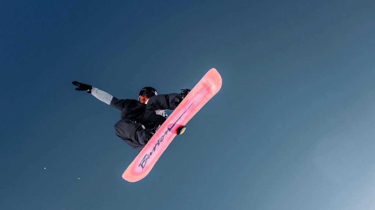 Snowboarder Brian Rice is pictured making a jump in Park City in the new Warren Miller film.