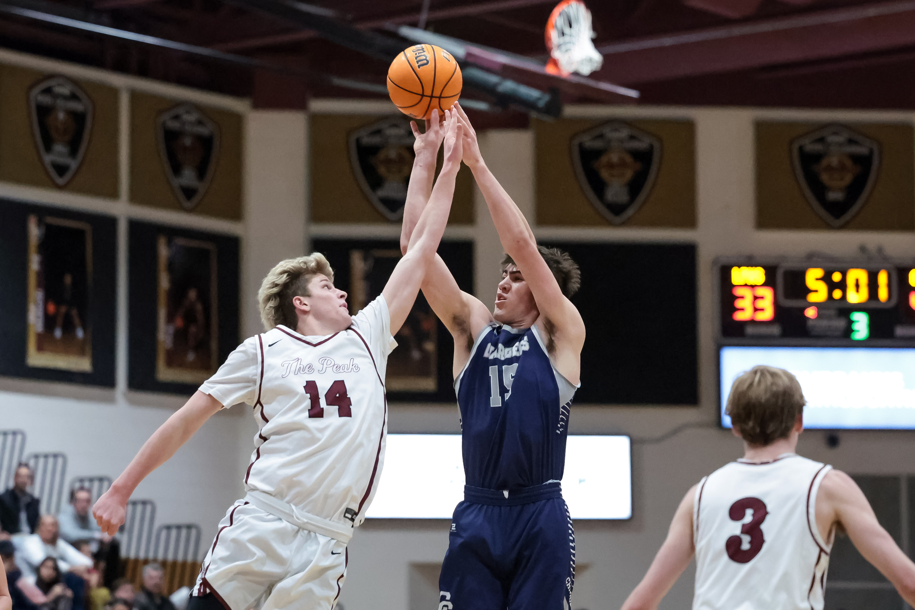 Corner Canyon’s Brody Kozlowski shoots over Lone Peak’s Luke Fotheringham in a high school boys basketball game in Highland on Tuesday, Jan. 24, 2023.