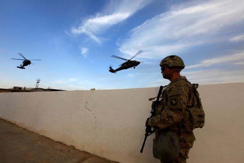 A U.S army soldier stands with his weapon at a military base in the Makhmour area near Mosul during an operation to attack Islamic State militants in Mosul, Iraq, Oct. 18, 2016.