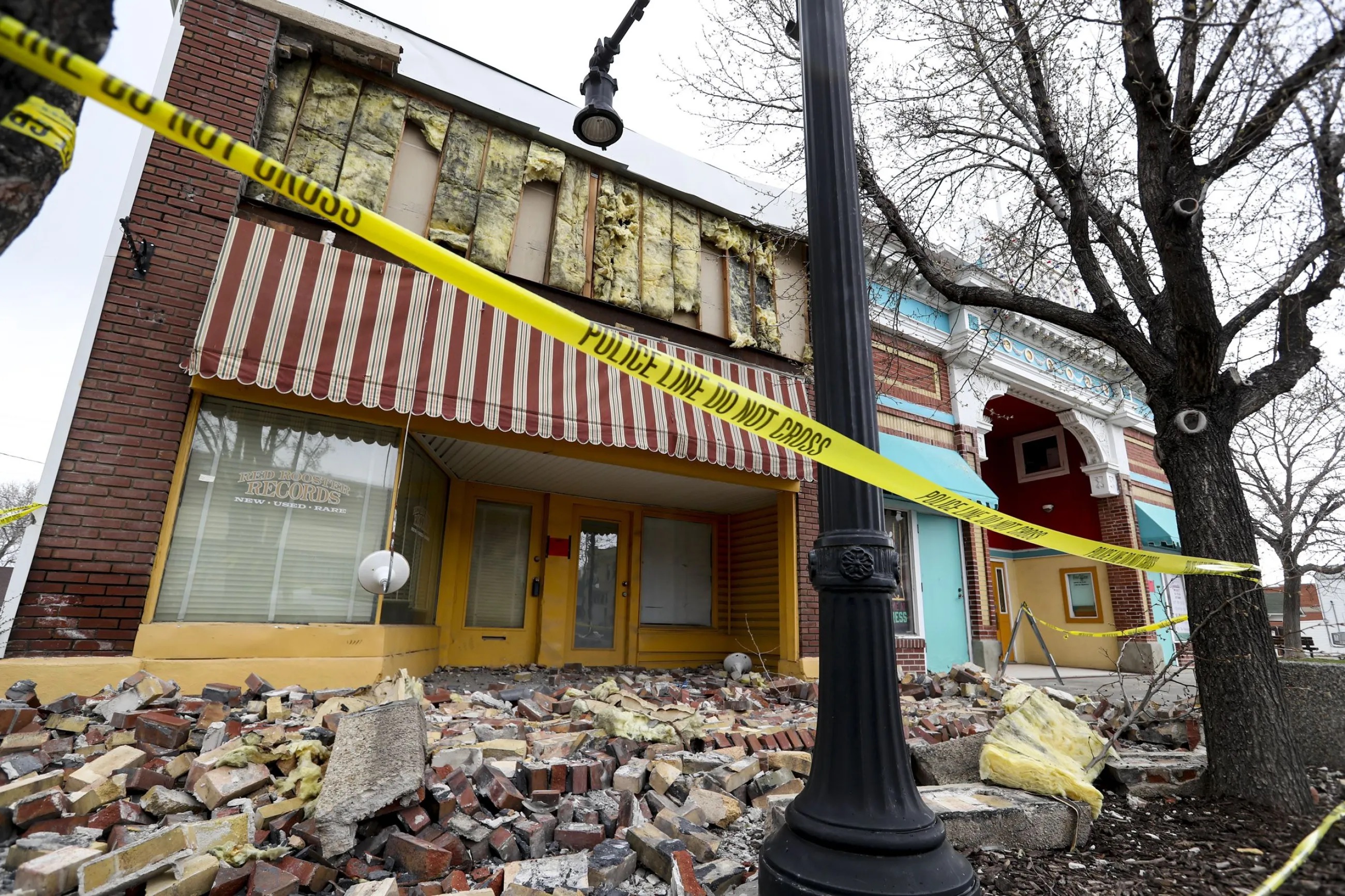 Caution tape surrounds a damaged building on Magna’s Main Street on March 24, 2020, following a 5.7 magnitude earthquake that was centered near the city on March 18, 2020. The 7.0 magnitude quake would have $80 billion in short-term impacts in Utah, federal research says.