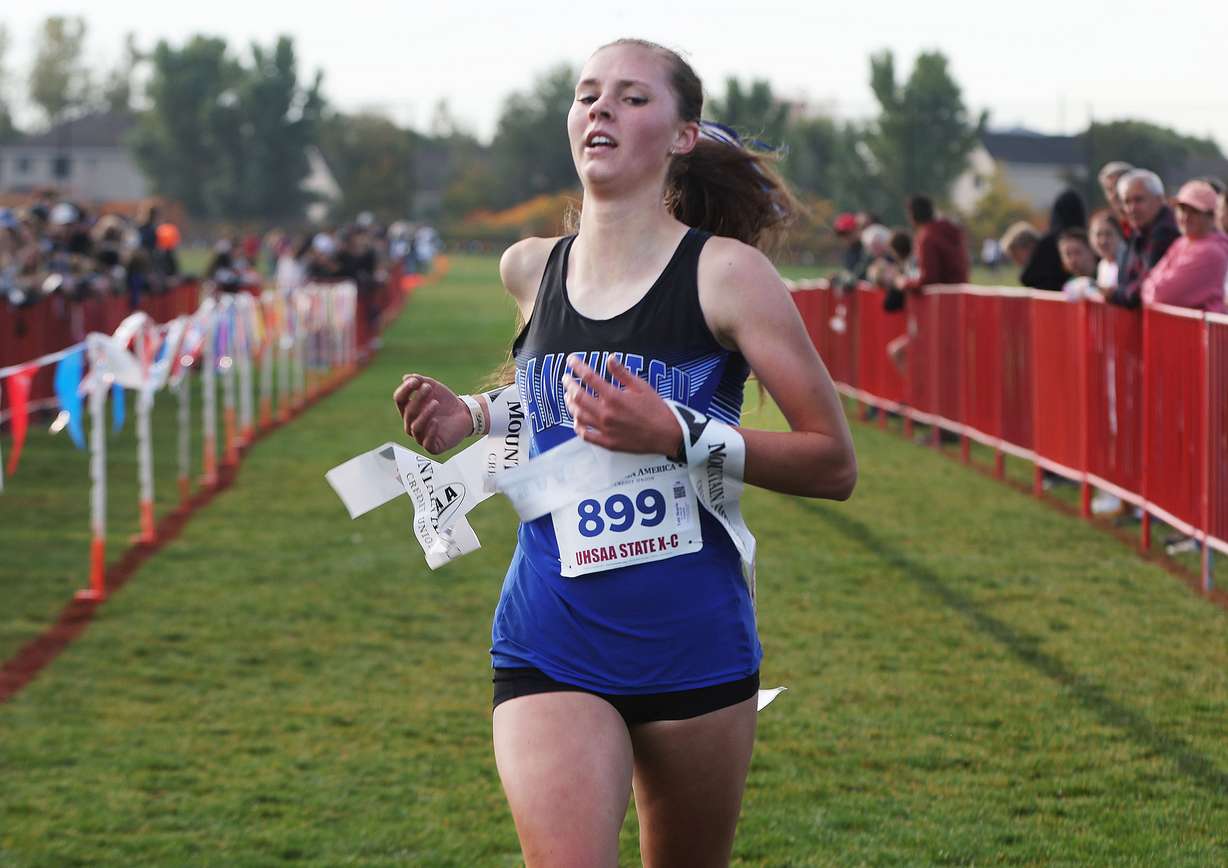 Tabi Henrie of Panguitch wins the 1A girls cross-country state championship at the Regional Athletic Complex in Rose Park on Tuesday, Oct. 24, 2023.