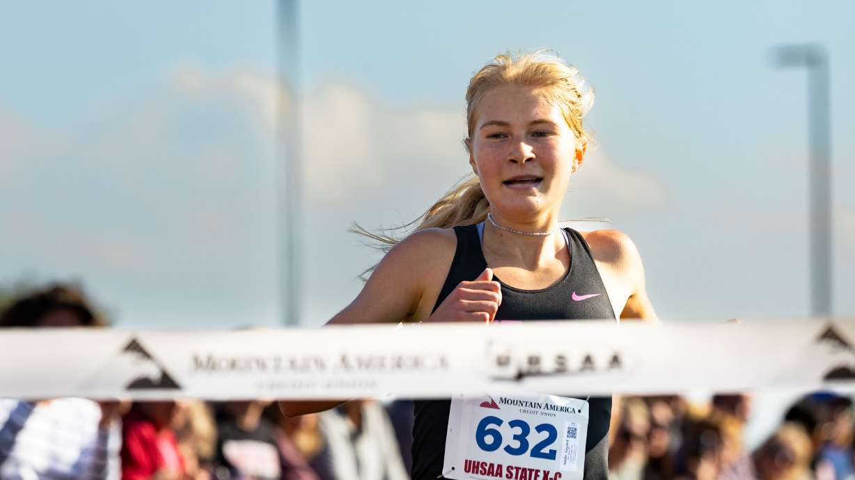 Lone Peak High School’s Andie Aagard crosses the finish line, taking first place in the 6A state high school cross-country championships, at the Regional Athletic Complex in Salt Lake City on Tuesday, Oct. 24, 2023.