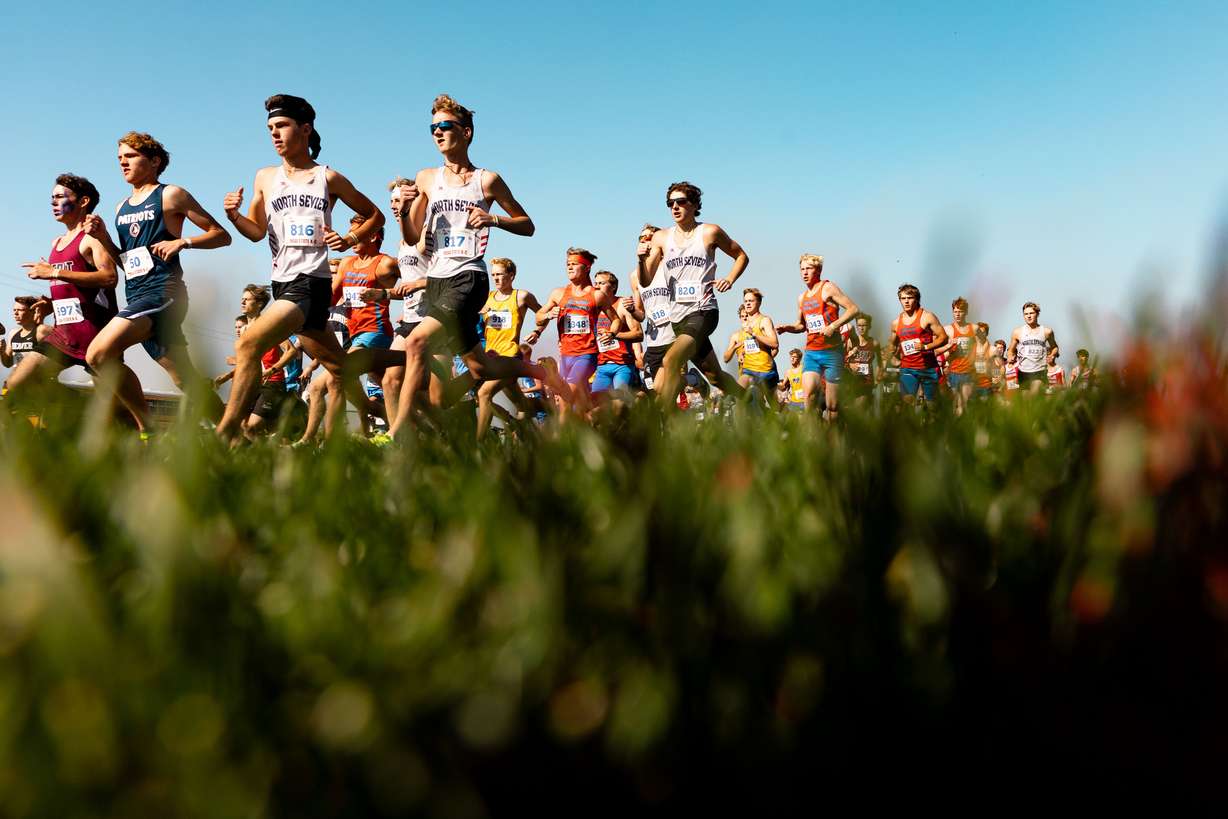 Runners compete during the 2A boys cross-country state championship race at the Regional Athletic Complex in Rose Park on Tuesday, Oct. 24, 2023.