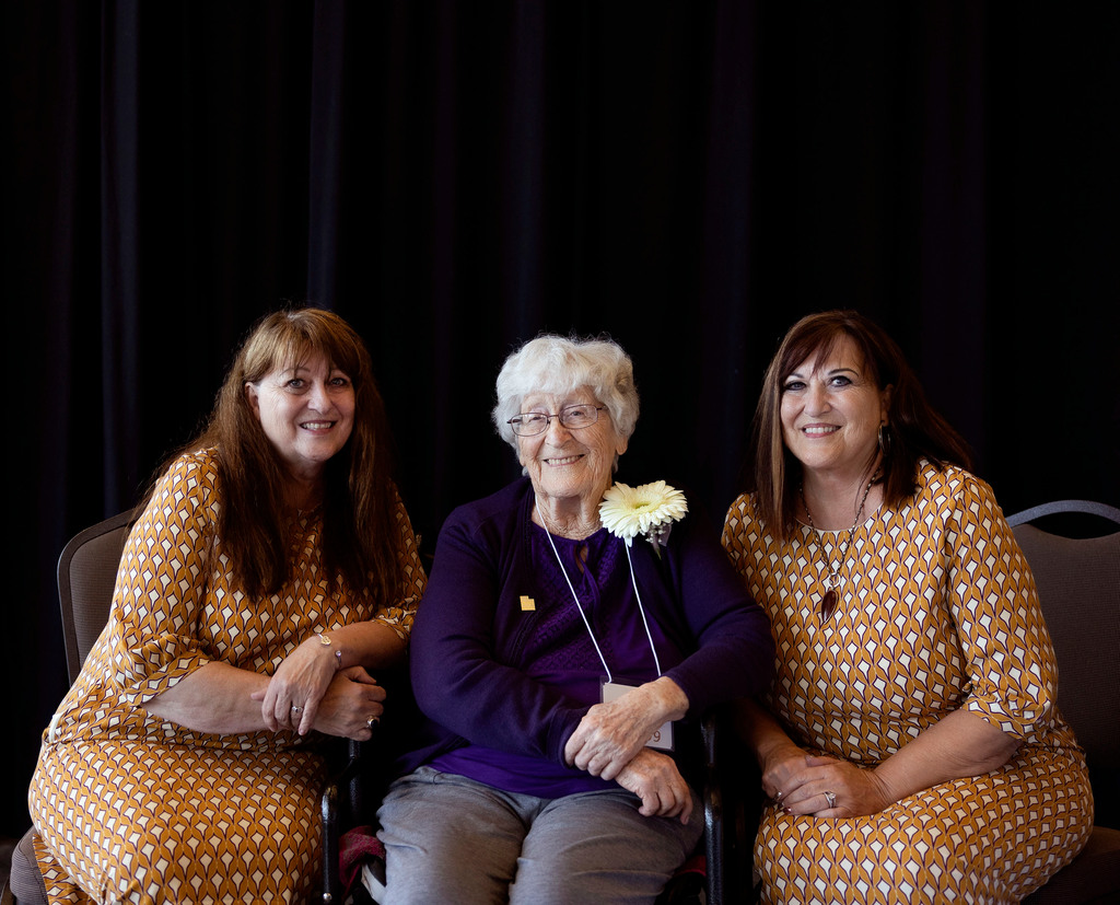 The twin daughters of 99-year-old Florence Turnbow, Marsha Harmon, left, and Marva Anderson, right, sit with their mother at a centenarian celebration in West Jordan on Aug. 24. The gap is closing between men and women when it comes to caregiving, and research suggests that men may build weaker support networks.