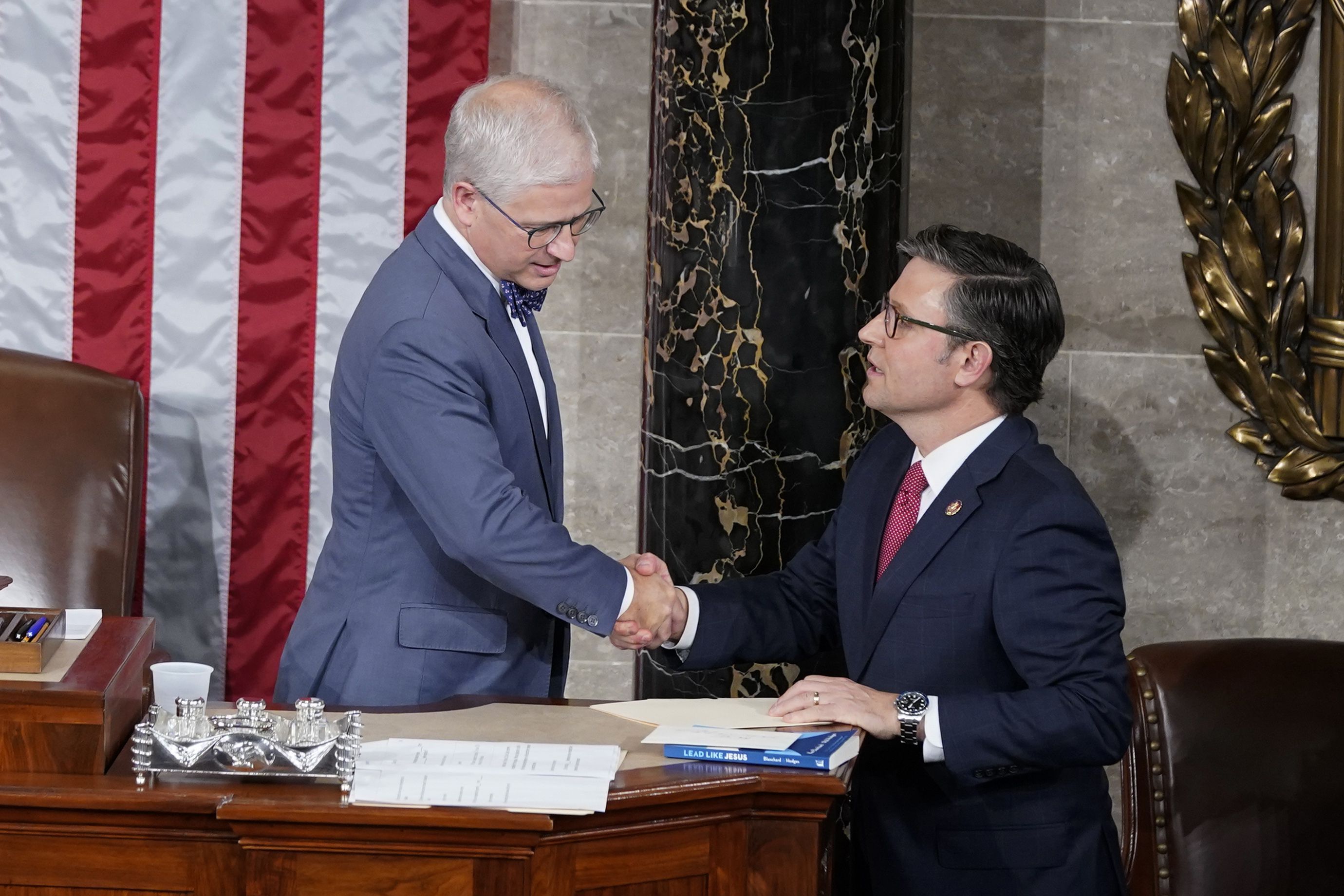 Temporary House speaker Rep. Patrick McHenry, R-N.C., talks with Rep. Mike Johnson, R-La., before Republicans try to elect Johnson to be the new House speaker, at the Capitol in Washington, Wednesday.