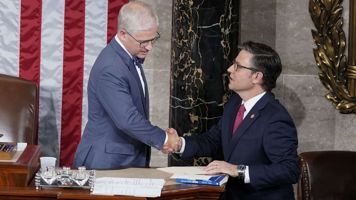 Temporary House speaker Rep. Patrick McHenry, R-N.C., talks with Rep. Mike Johnson, R-La., before Republicans try to elect Johnson to be the new House speaker, at the Capitol in Washington, Wednesday.