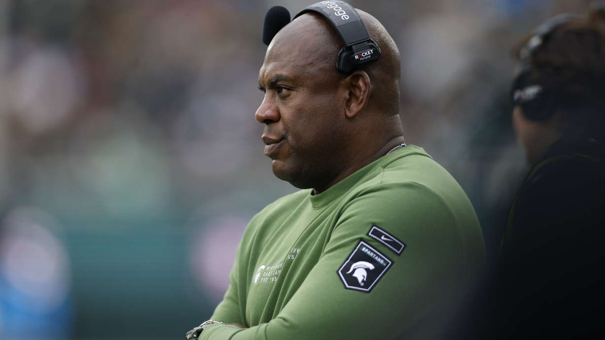 FILE - Michigan State coach Mel Tucker watches the team's NCAA college football game against Rutgers, Nov. 12, 2022, in East Lansing, Mich. A Michigan State University hearing officer has determined that former coach Tucker sexually harassed rape survivor and activist Brenda Tracy, a person familiar with the ruling told The Associated Press on Wednesday, Oct. 25. The hearing officer ruled Tucker was in violation of several terms of his contract, according to the person, who spoke on condition of anonymity because they are not authorized to comment publicly on the investigation.