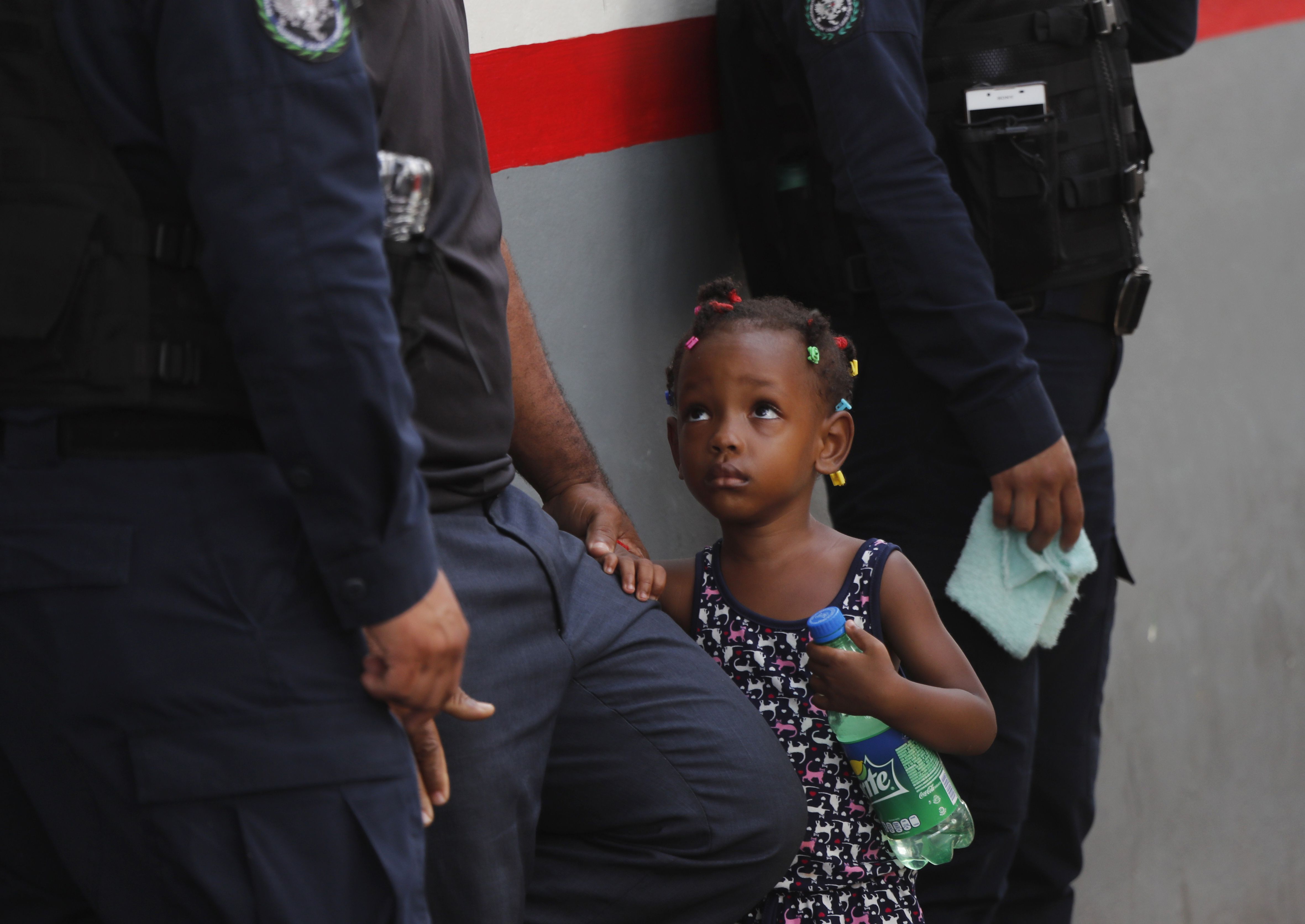 Federal police and migration officers hold a child at an immigration center in Tapachula, Chiapas state, Mexico on May 27, 2019. Sen. Mike Lee said he was worried about unaccompanied migrant children the government has lost track of. 