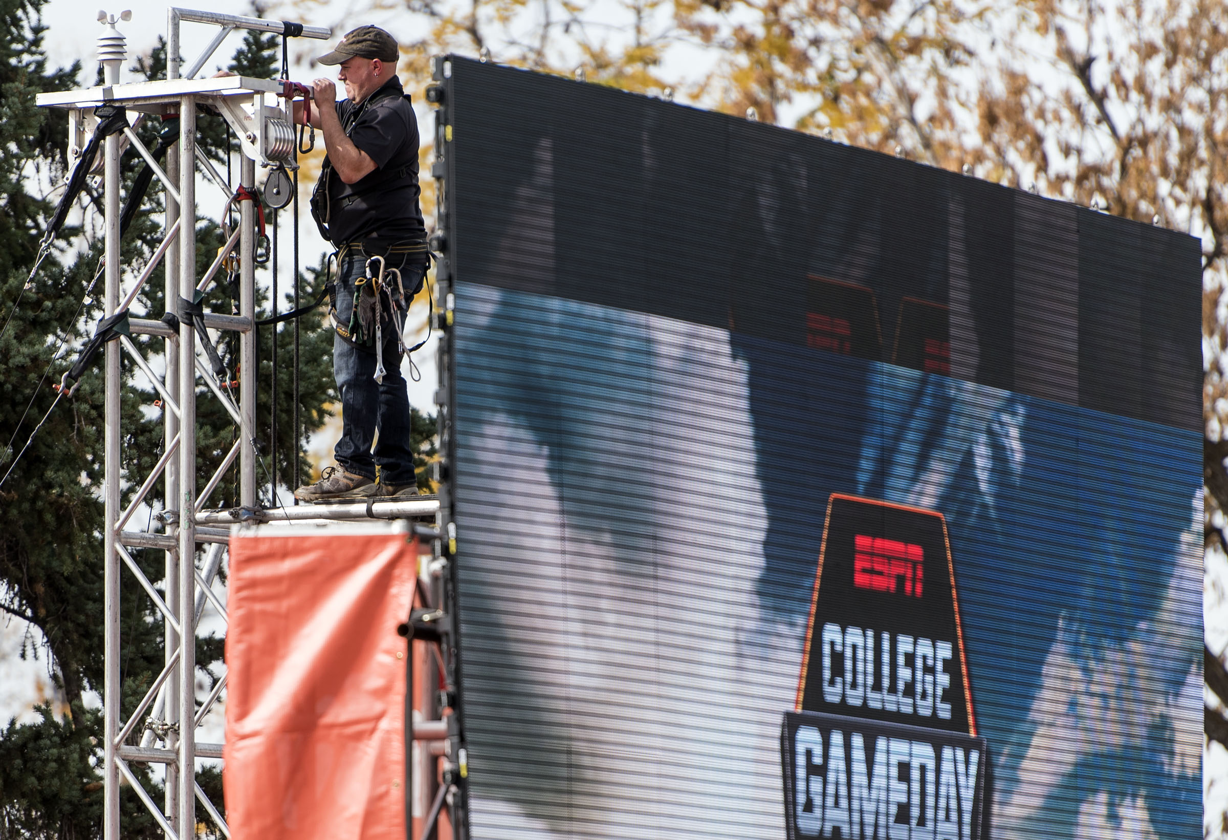 A crew member puts together the set for ESPN's “College GameDay” on Presidents Circle on the University of Utah campus in Salt Lake City on Thursday, Oct. 27, 2016.